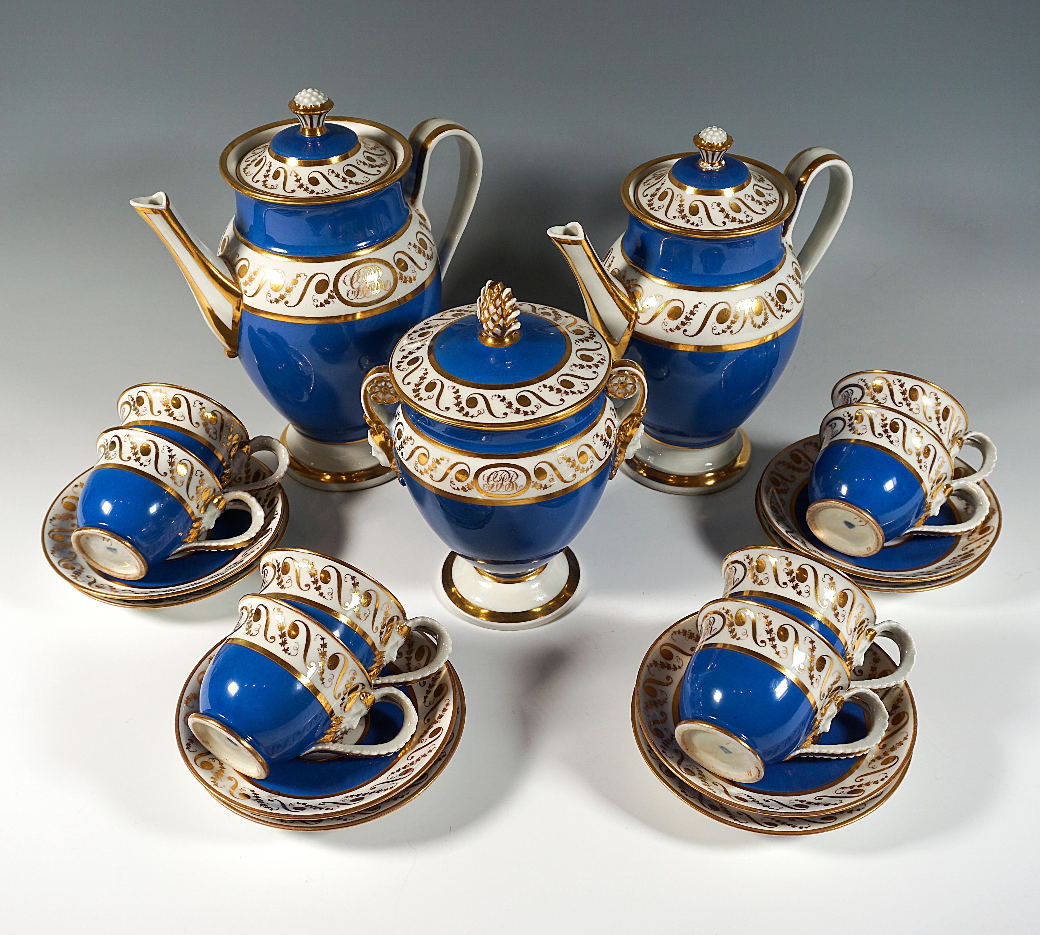 Elegant 19-piece coffee service consisting of a coffee pot, a large milk or hot water pot, a large sugar urn and eight coffee cups with saucers.
Large bulbous vessels on stepped stand, the jugs with raised handles have set slender spouts stretching