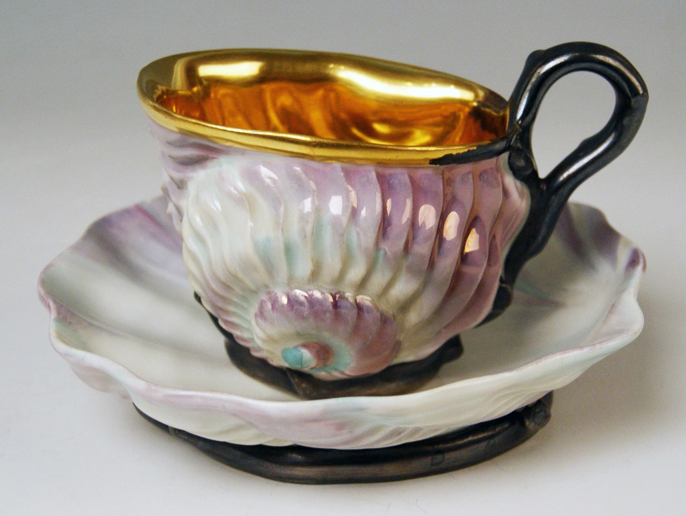 Cup as well as saucer or rare form type:
Handled Cup Shaped As Snail / Saucer Having Appearance Of A Round Clam

Vienna / Old Imperial Austrian Porcelain Manufactory 
(= Alt Wien / Kaiserliche Porzellan Manufaktur)
dated 1826

Hallmarked:
--