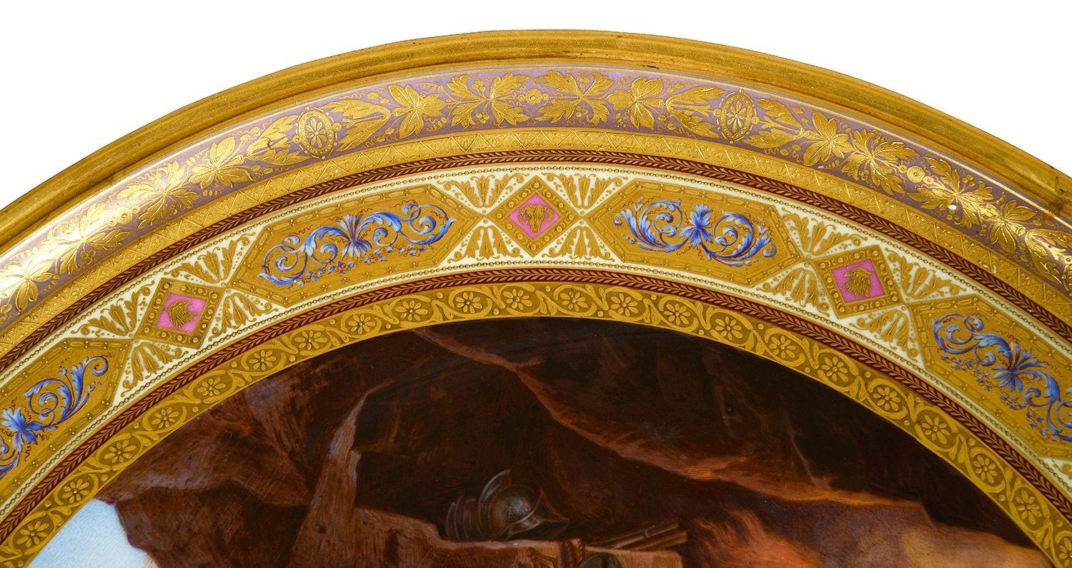 This exquisite late 19th-century Vienna porcelain charger features a vibrant depiction of “Venus in the Forge of Vulcan.” The scene captures the mythical goddess of love, Venus, surrounded by a group of elegantly rendered figures, including Vulcan,