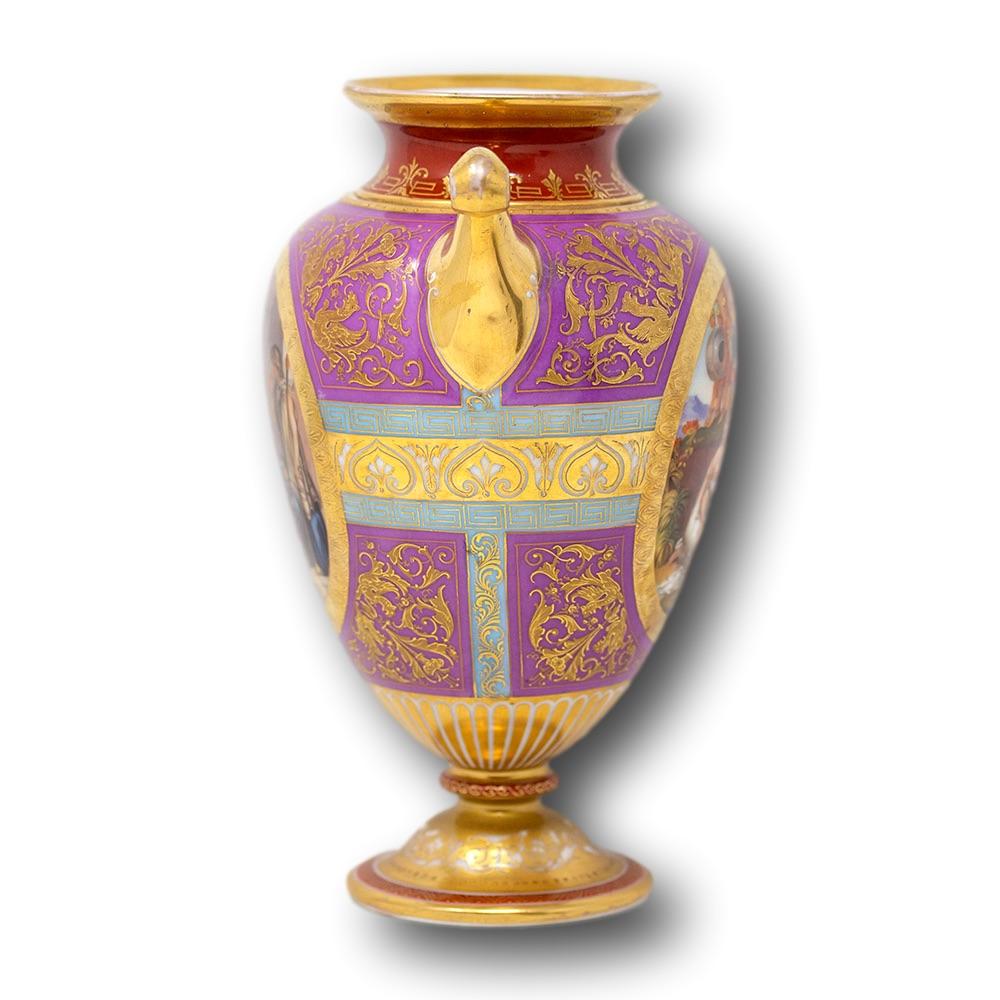 Fine ‘Vienna‘ Austria porcelain vase. The vase of Classic Roman shape with flared rim and pinched neck with scrolling shoulders and tapered body stood upon a circular base. Two classical scenes feature, one on each side with Roman soldiers and