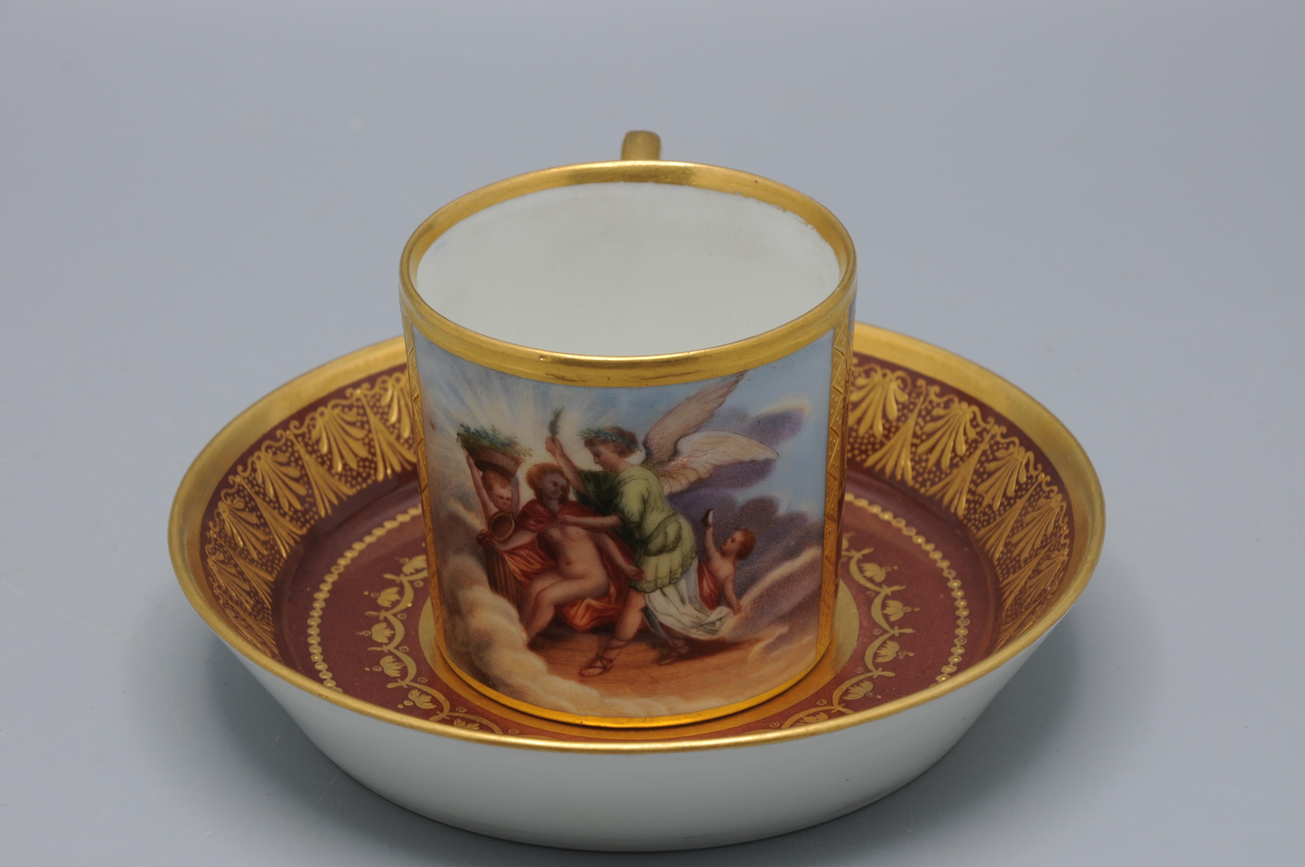 This fine cup and saucer set was produced by the Wiener Porzellanmanufaktur, also known as the Kaiserlich privilegierte Porzellan-Fabrik, established in 1718. Founded by Claudius Innocentius du Paquier, it was Europe's second-oldest porcelain