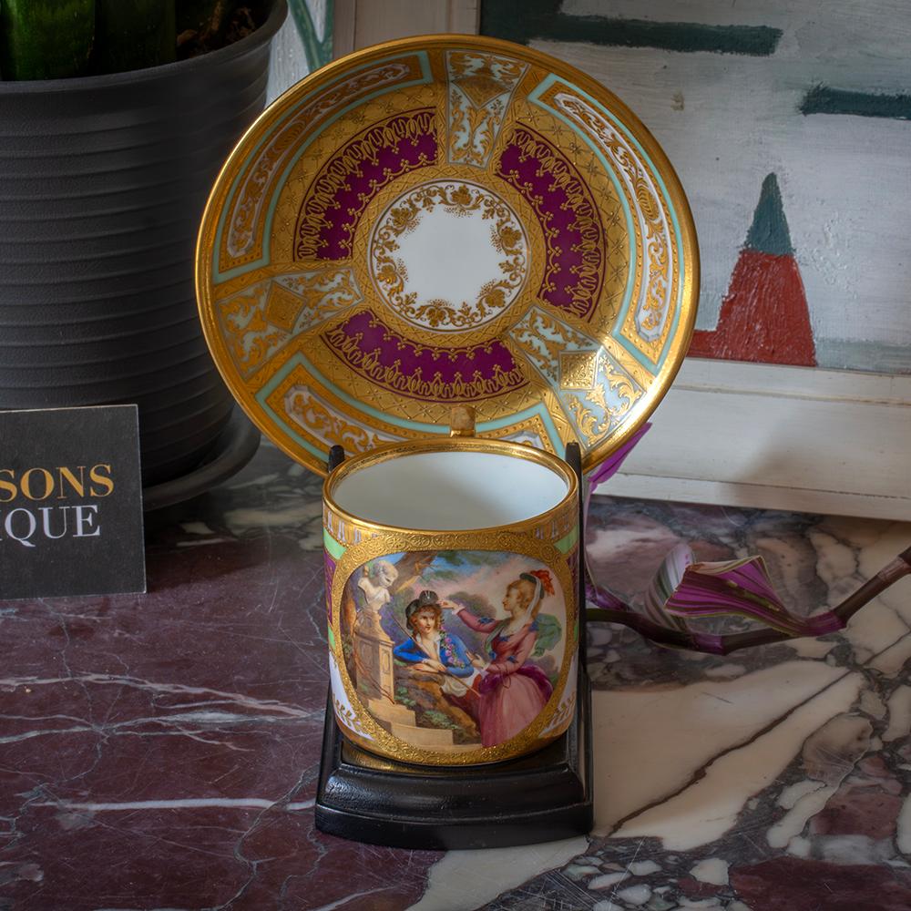 Decorated with a Female Portrait

Measurements Saucer 2.7cm High x 13.4cm Diameter (1.1 x 5.3 Inches) Cup 6.5cm High x 8.5cm Long x 6.5cm Wide (2.56 x 3.35 x 2.56 Inches)

From our Ceramics collection, we are pleased to offer this Vienna Cup and
