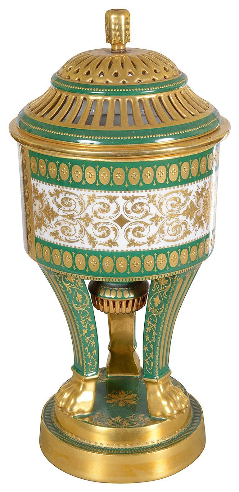 A very good quality late 19th Century Vienna porcelain pierced, lidded Potpourri urn. Having this wonderful classical hand painted scene depicting reclining maidens playing with cherubs.  A green  ground with gilded decoration, raised on three