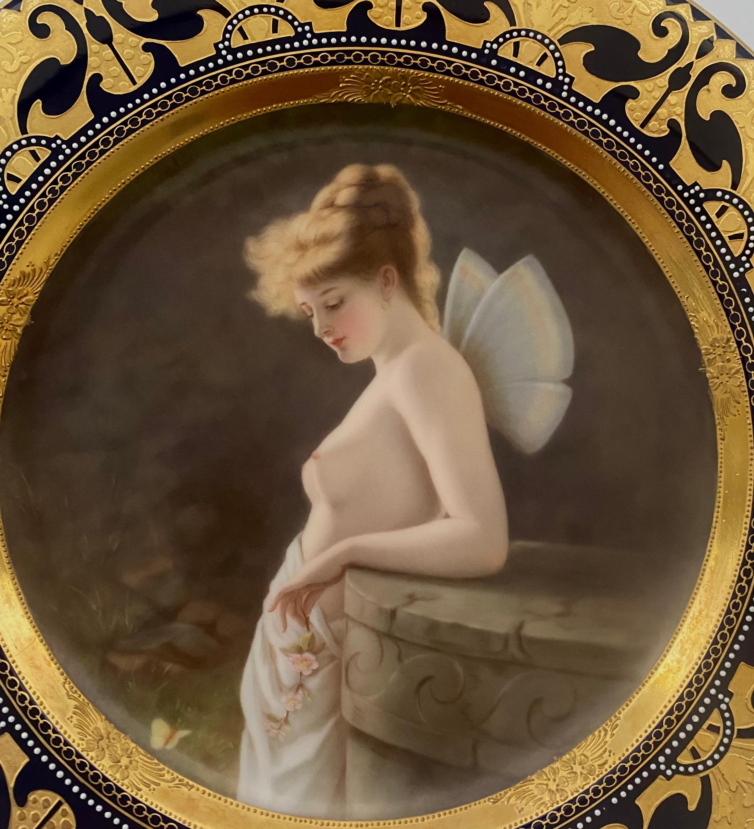 Vienna style porcelain plate, by Hutschenreuter, c. 1900. Beautifully hand painted and signed by F. Becher, with a titled portrait ‘Psyche Rege’. The bare breasted Nymph, leaning against a pillar, observing a butterfly, whilst holding a sprig of