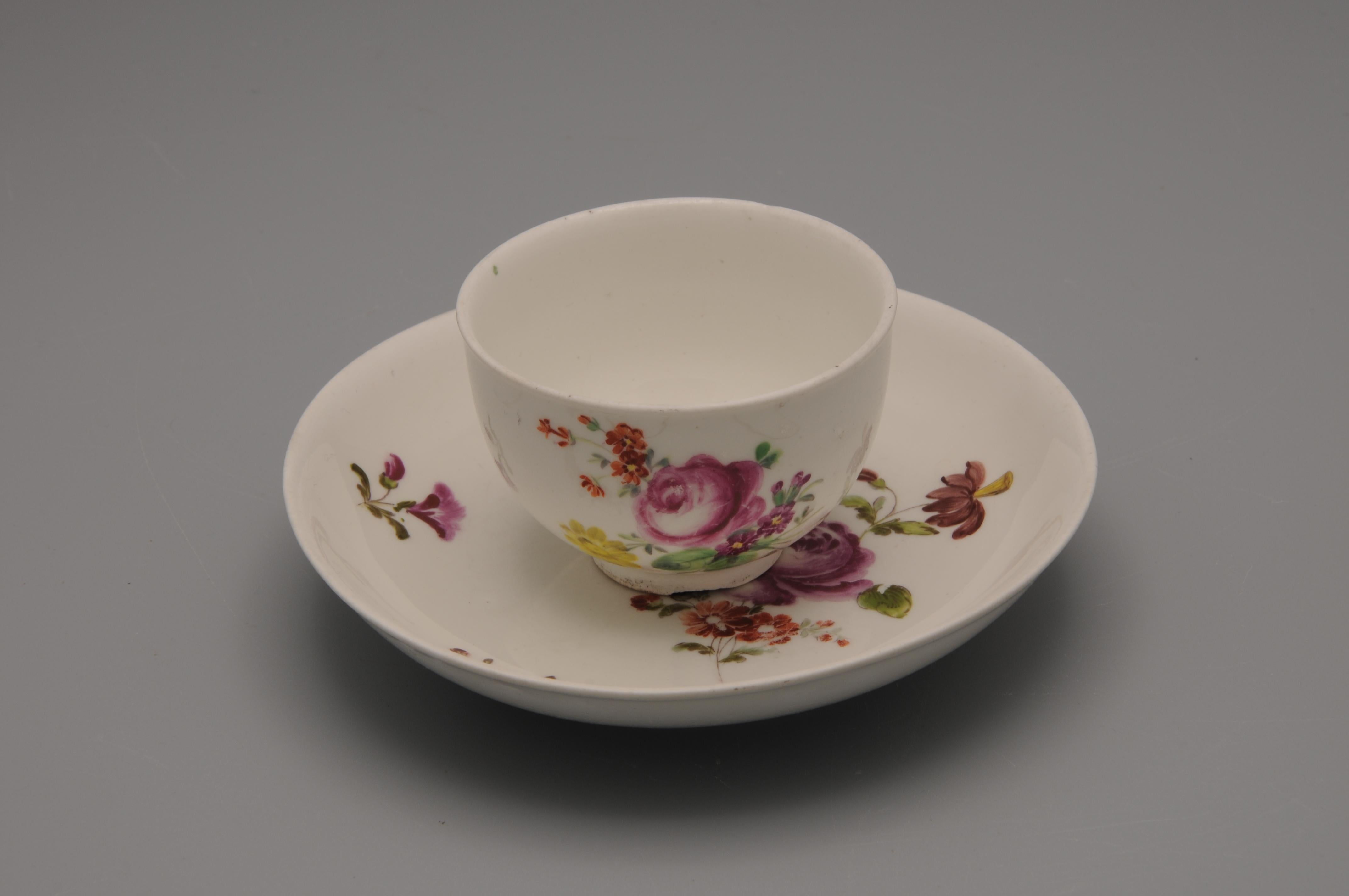 Vienna Porcelain Coffee or Mokka Cup and Saucer with floral decoration.

Product of the Vienna Porcelain Manufactory (German: Kaiserlich privilegierte Porcellain Fabrique), a porcelain manufacturer in Alsergrund in Vienna, Austria. It was founded in