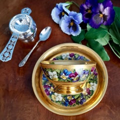 Vienna Porcelain Teacup and Saucer, Gilt and Pansies by Anton Friedl, 1826