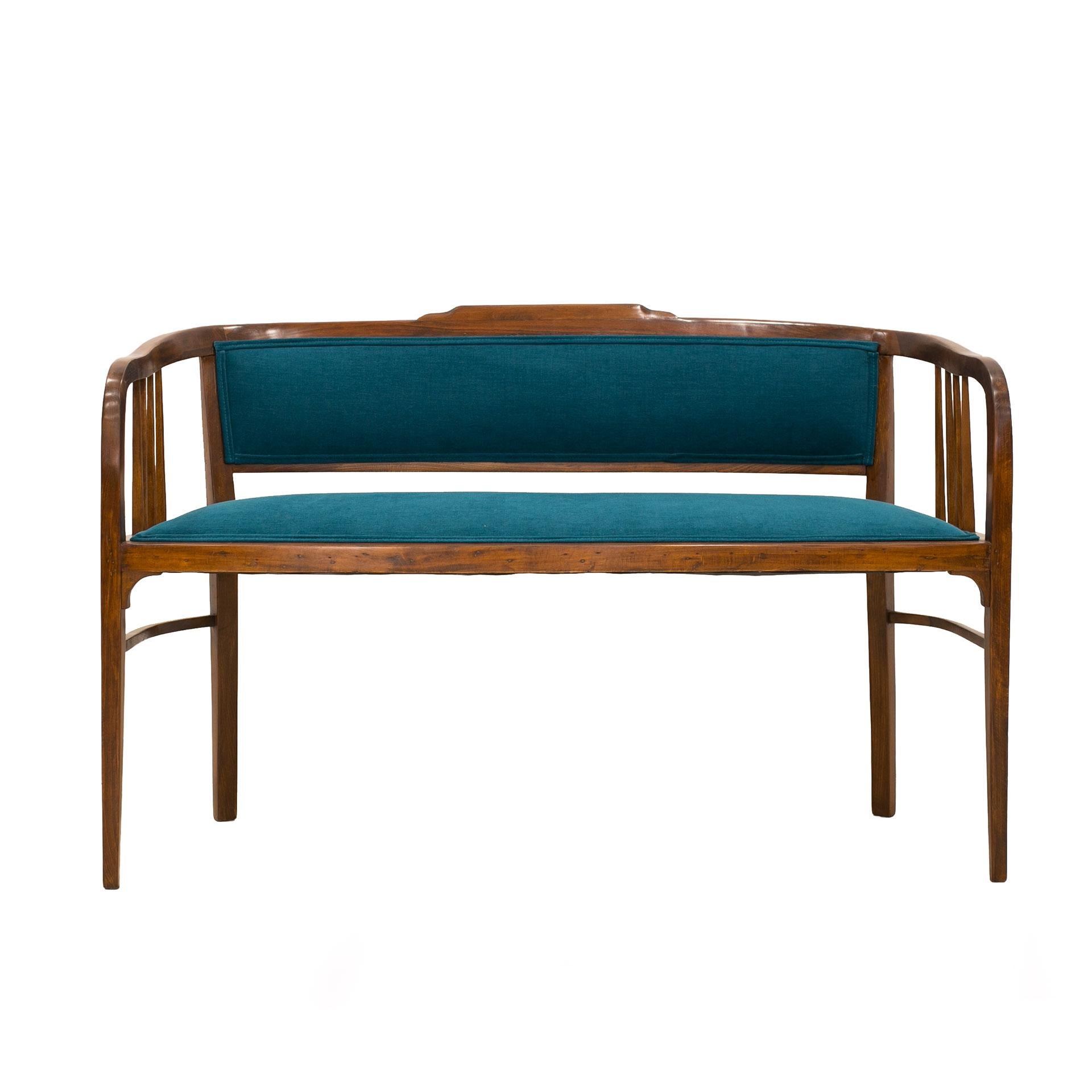 Beautifully restored bench settee from early 20th century from Austria. The bench features reupholstered seat and back in deep blue turquoise fabric. Beech wooden surfaces have been cleaned and finished with high-quality wood oil. Despite seemingly