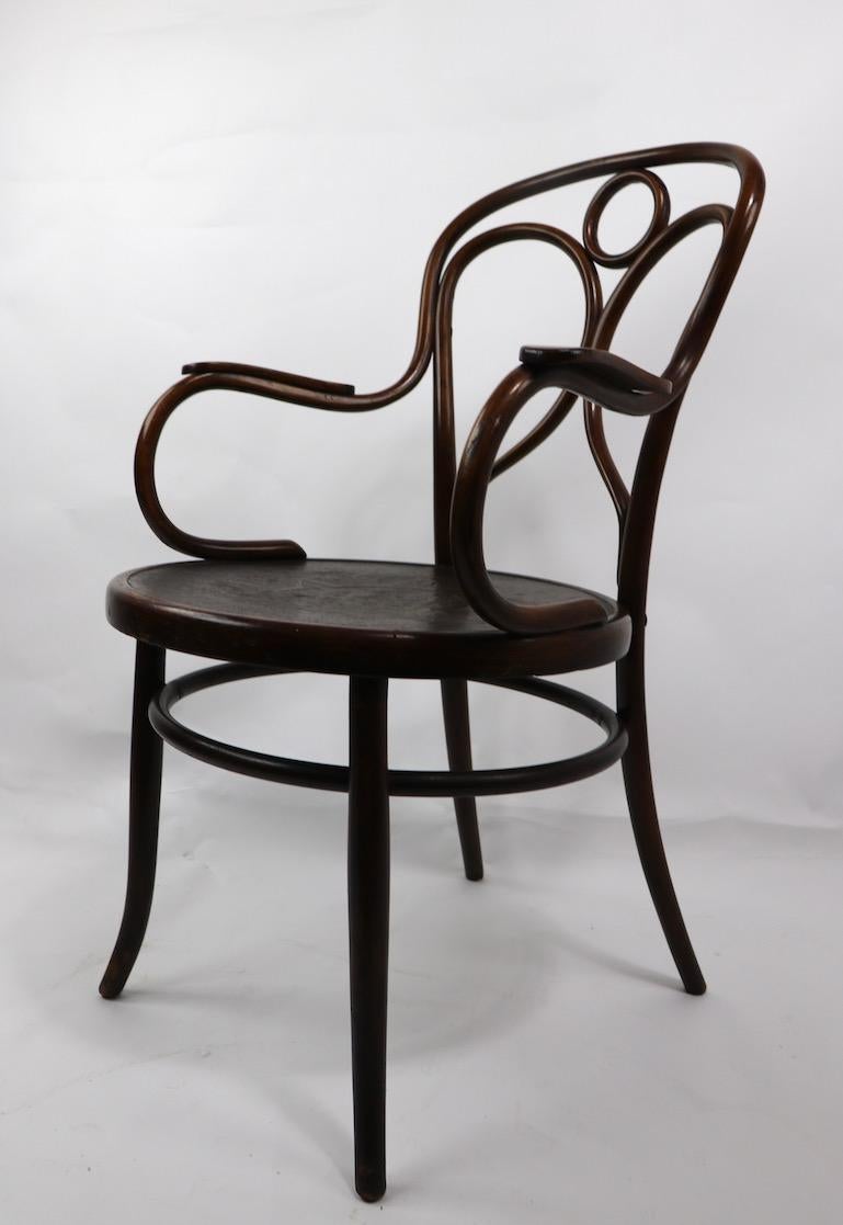 Attractive bentwood arm chair from the Vienna Secessionist Movement , by Fischel ( competitor of Thonet ). This example is in very fine, original condition, clean and ready to use, Seat H 18 x Arm H 27 x Total H 37.5 in.