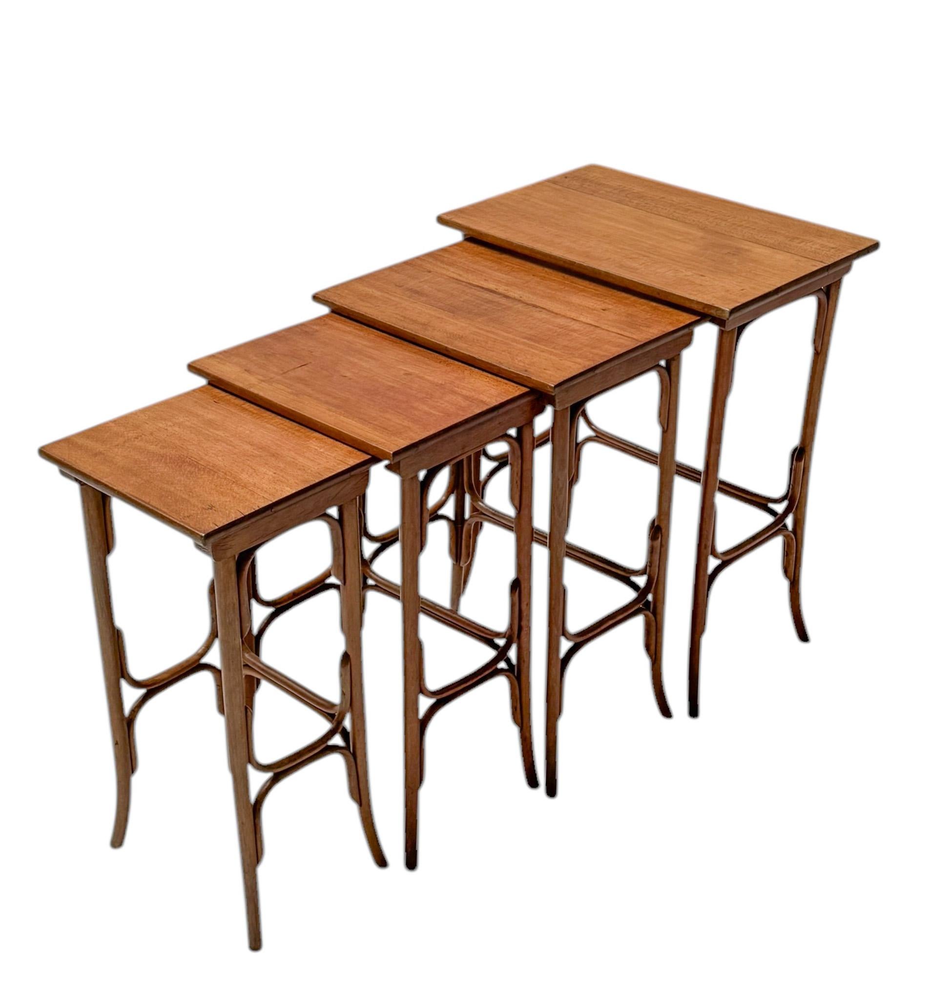 Magnificent and rare set of four Vienna Secession nesting tables.Design by Michael Thonet for Gebrüder Thonet.Striking Austrian design from the 1900s.Original bentwood and beech frames with original manufacturers paper label underneath  a table