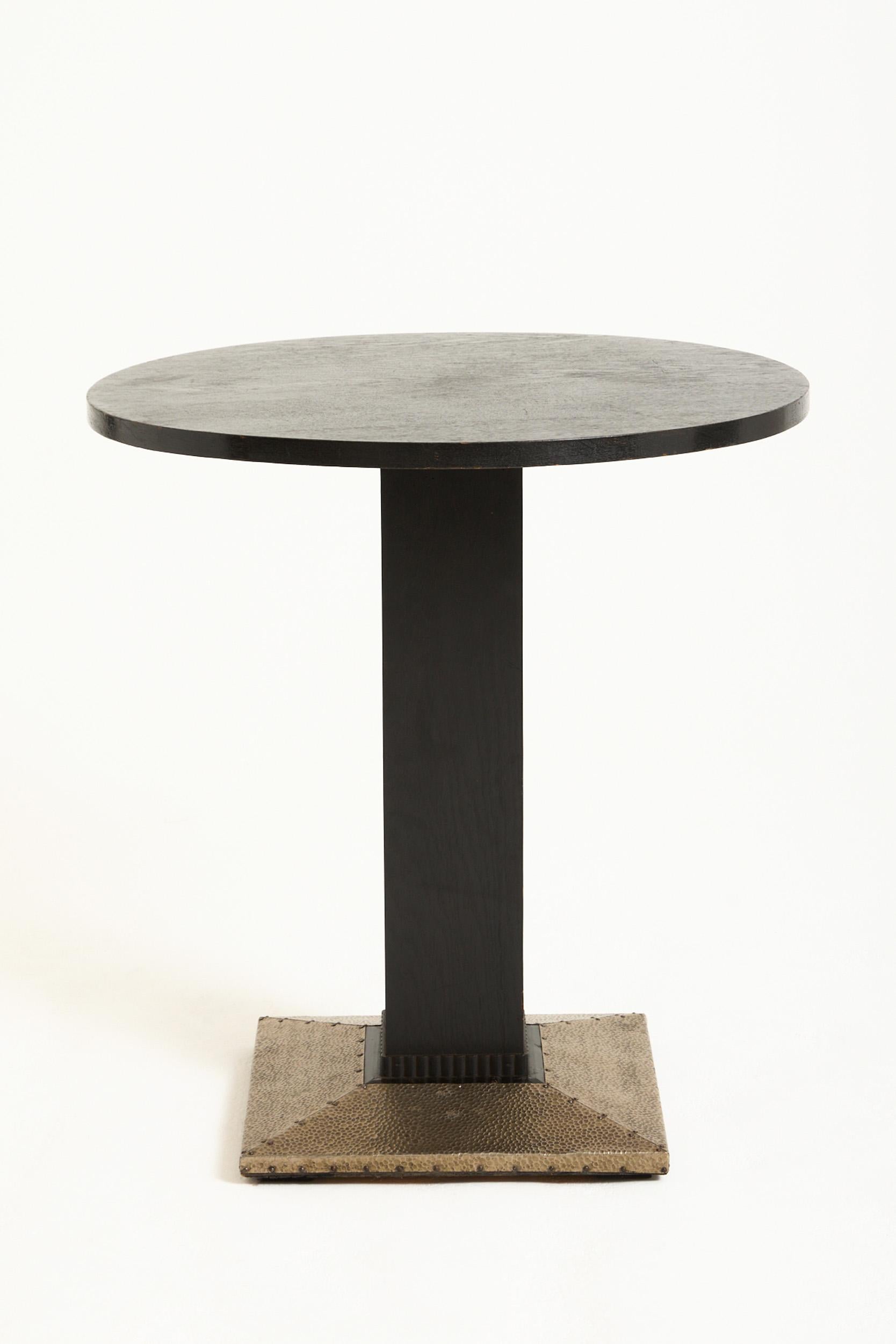 A Vienna Secession ebonised oak and hammered silvered iron gueridon table
Austria, Circa 1910
