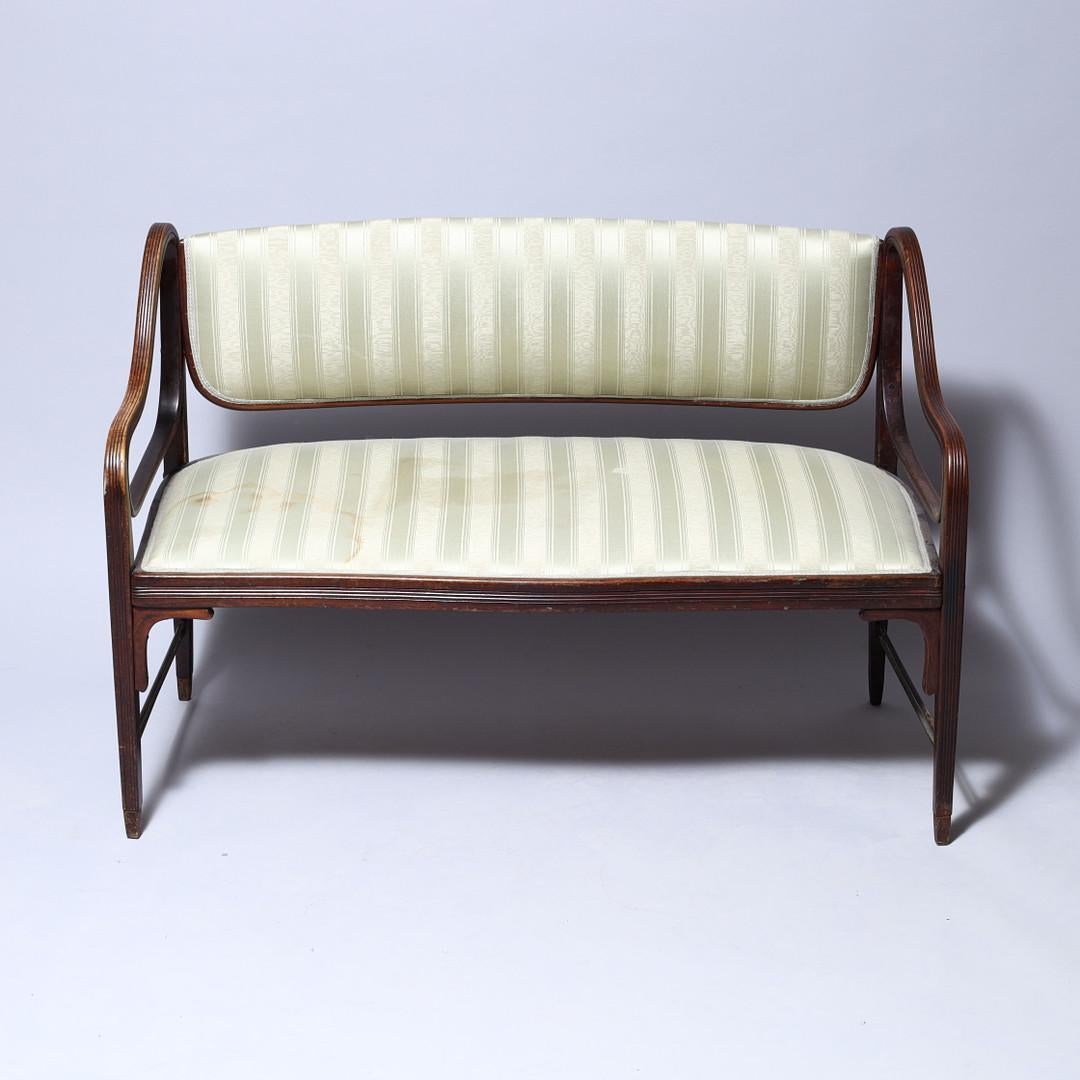 Rare, beech bentwood frame with an upholstered seat and backrest. First time mentioned in the J. & J. Kohn catalog 1906 with the catalog no. 412. 
Designed by Otto Wagner for J. & J. Kohn about 1905, catalog no. 412. Still in original condition.