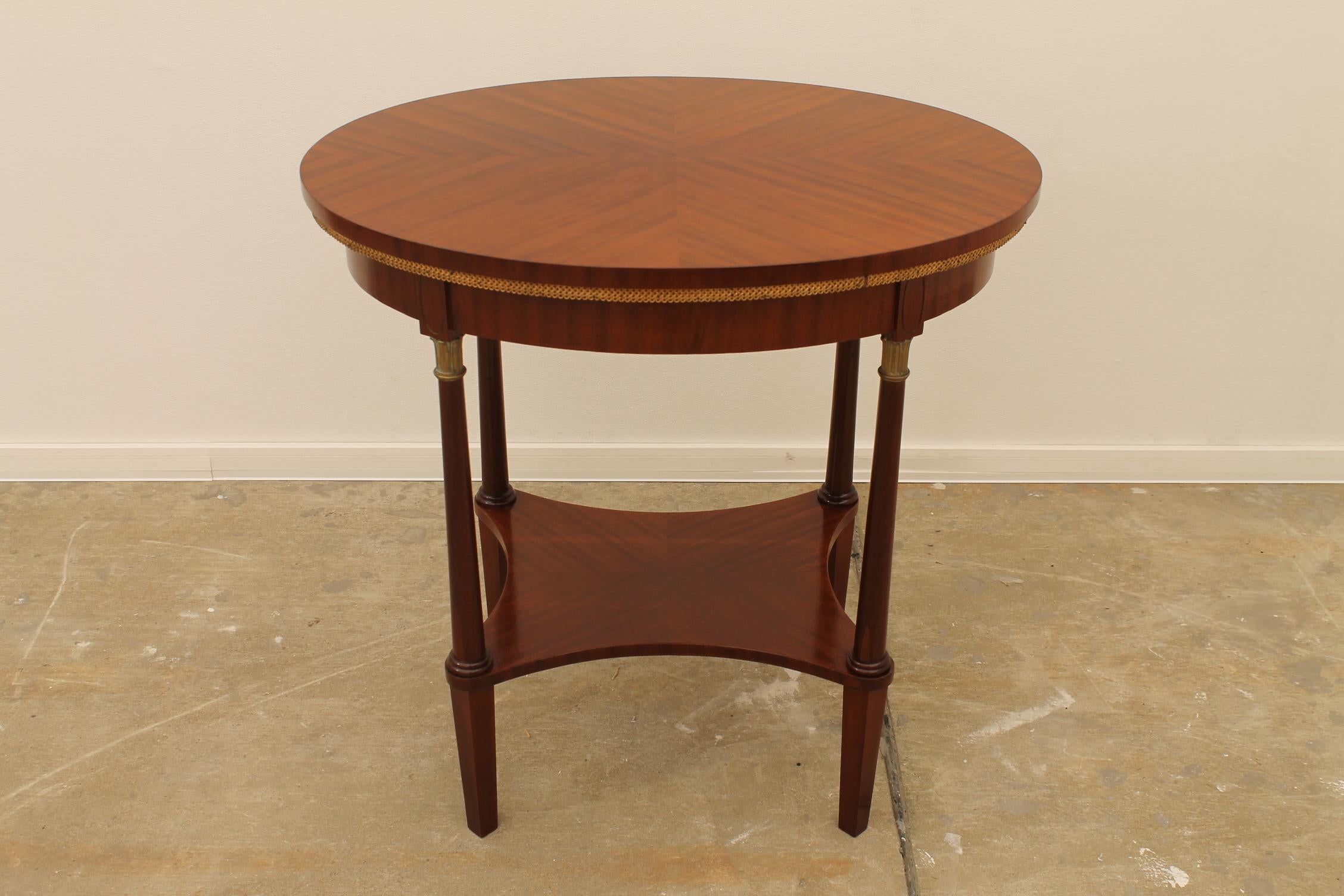 This mahogany side table was made circa in 1915. It features elements and shapes including gilded decorative motifs typical of the Art Nouveau period. It was manufactured in Austria-Hungary. It´s made of solid wood with mahogany veneer.
The table