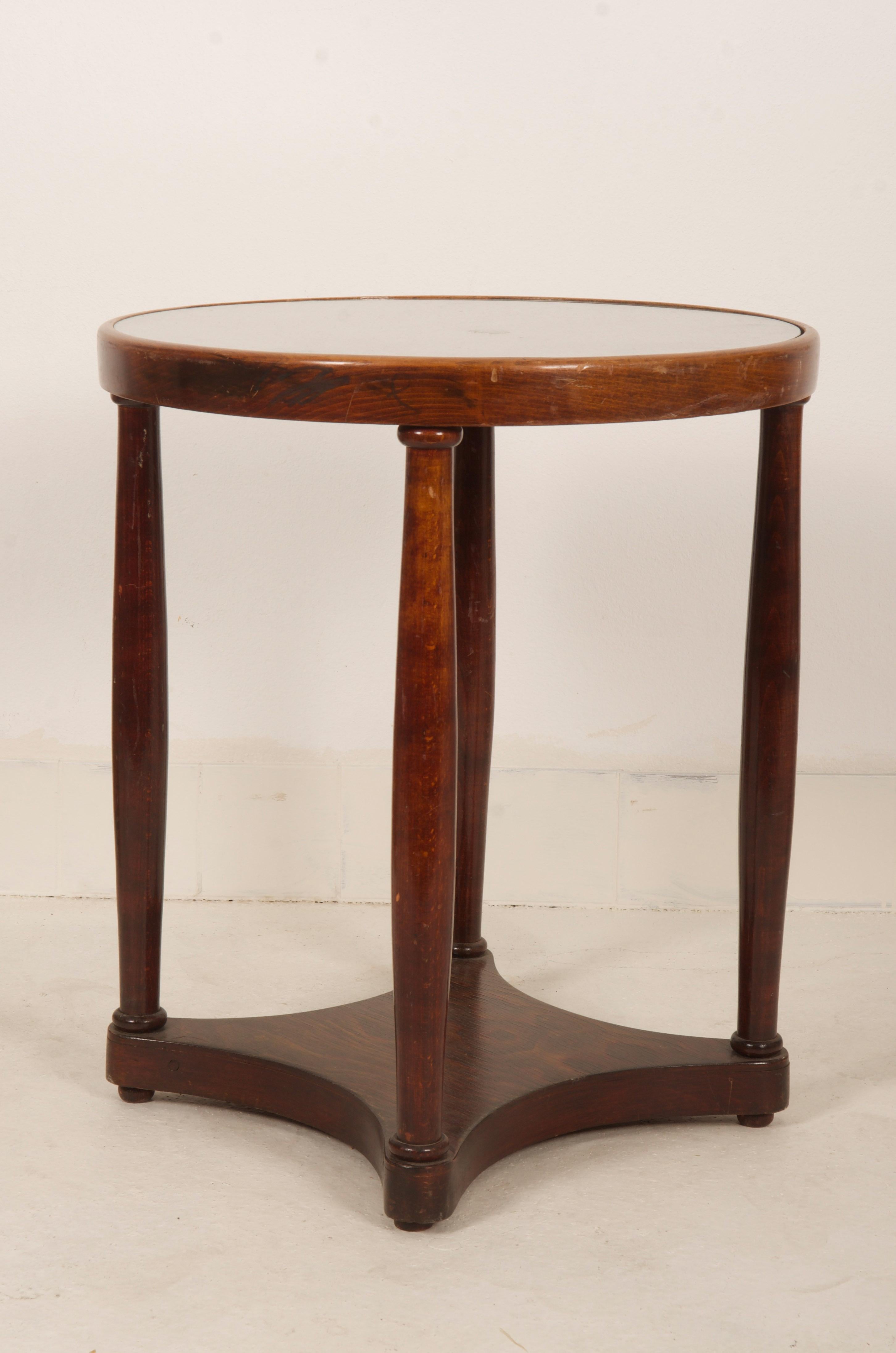 Round table with a glass top, designed about 1910 by Josef Hoffmann for J&J Kohn, Vienna, beechwood, stained to dark mahogany.
It was restored but visible signs of use, otherwise it is in good.
Factory mark on the underside.
