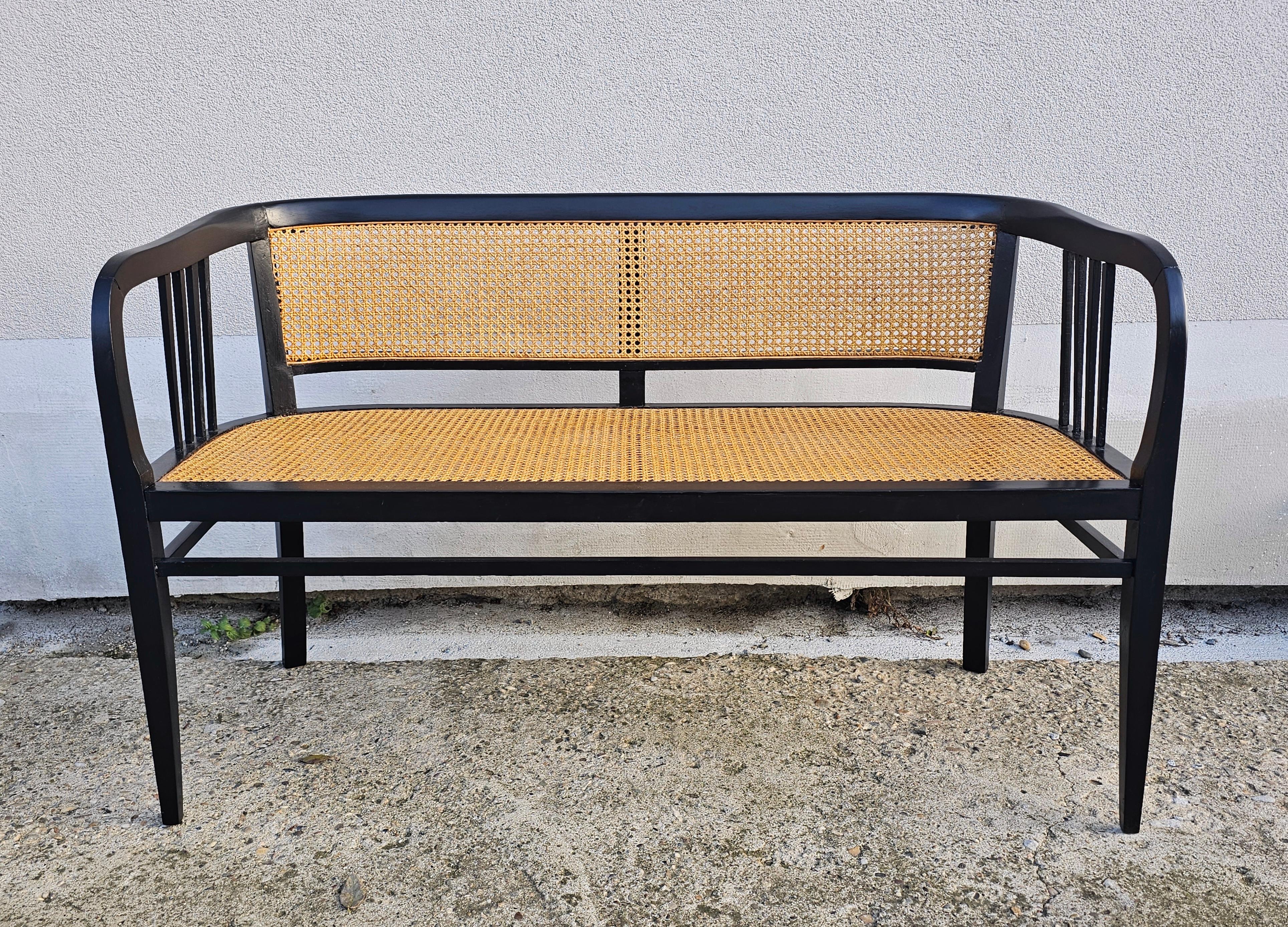 Austrian Vienna Secession Settee done in beech with the cane seat and backrest For Sale