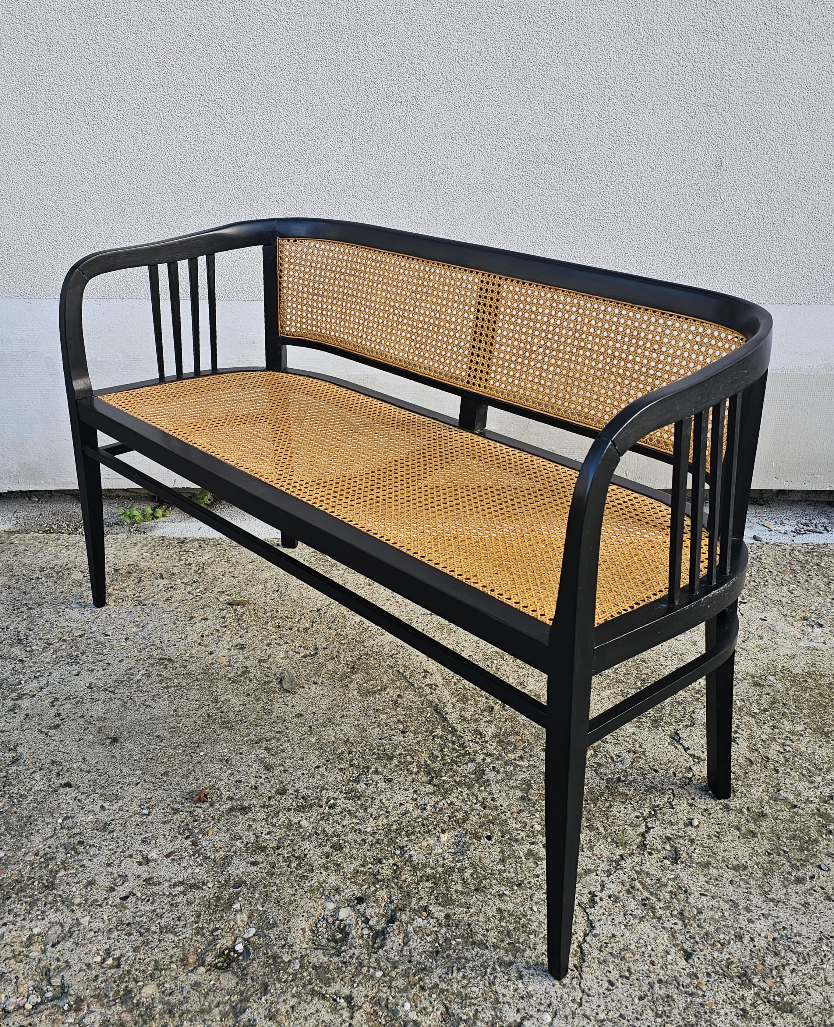 Early 20th Century Vienna Secession Settee done in beech with the cane seat and backrest For Sale