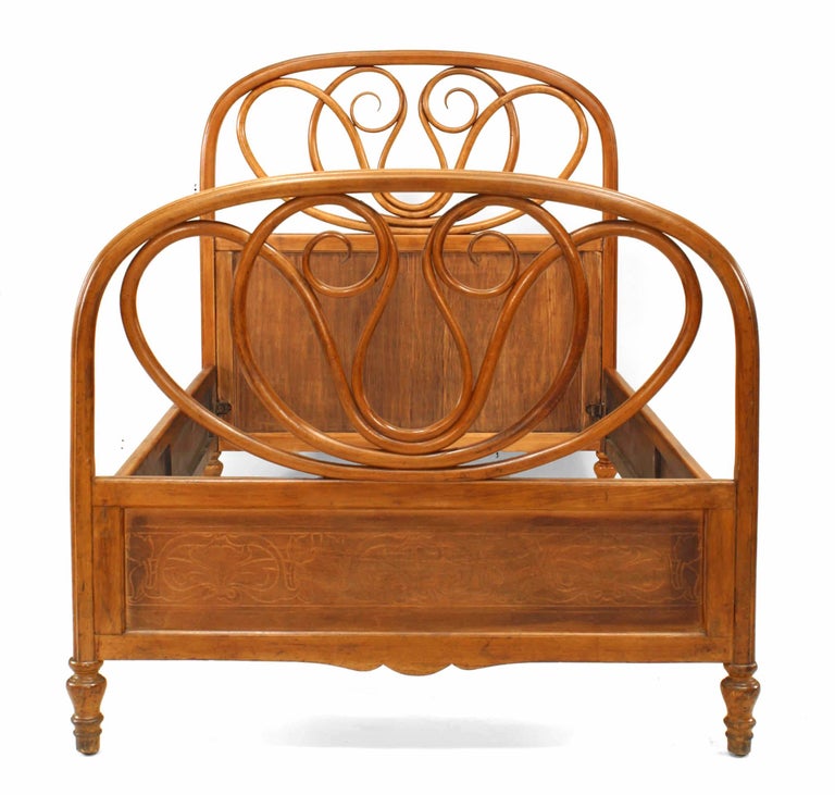 Bentwood (19/20th Century) maple stained twin size bed with double scroll center design (includes: headboard, footboard, rails).(paper label: JACOB JOSEP KOHN, WEIN). (Irregular size, check measurements).
