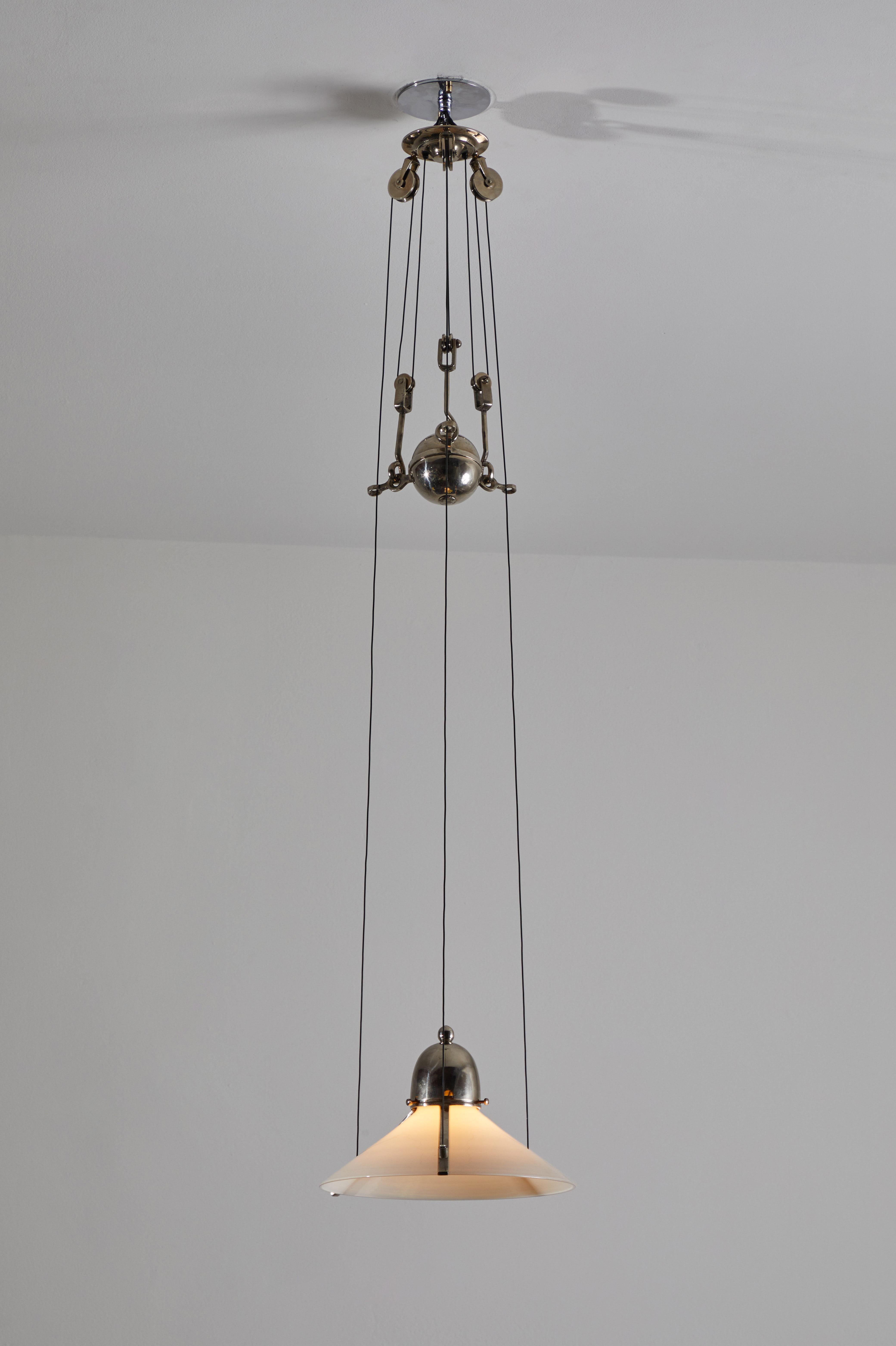 Vienna secession suspension light. Designed and manufactured in Austria as part of the Vienna Secession period circa 1920s. Opaline glass, nickel, cord. Rewired for U.S. junction boxes. Light adjust to various heights by way of pulley mechanism.