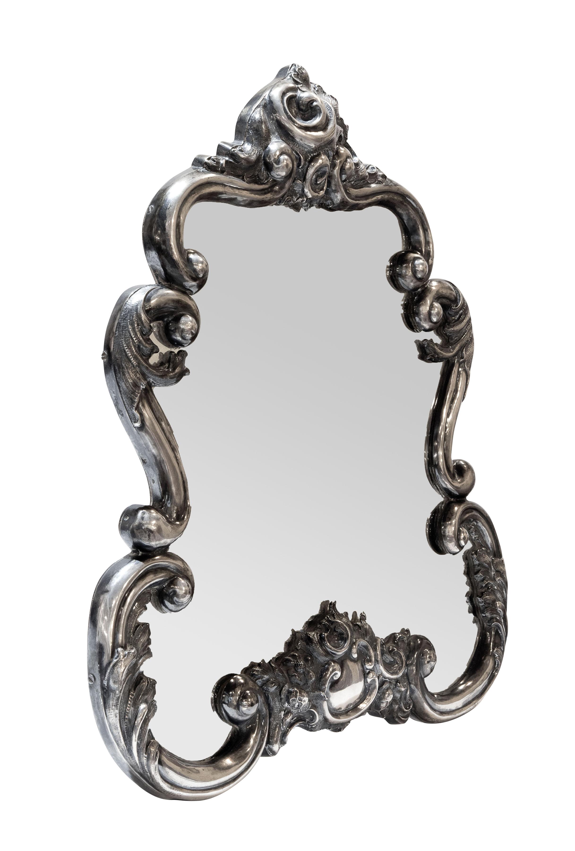Vienna silver vanity mirror is hallmarked, 1855. Ornate repoussé decoration.