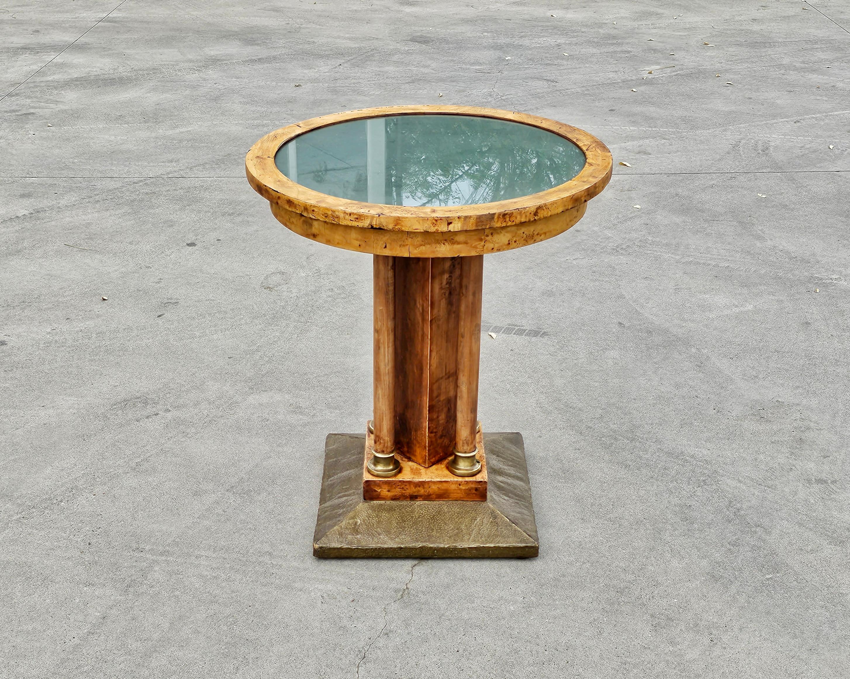 In this listing you will find an antique Viennese Secessionist Gueridon table or Pedestal Side Table done in Birdseye maple, with decorative elements done in brass. Table is the standard height for a dining table, so it could be used for various