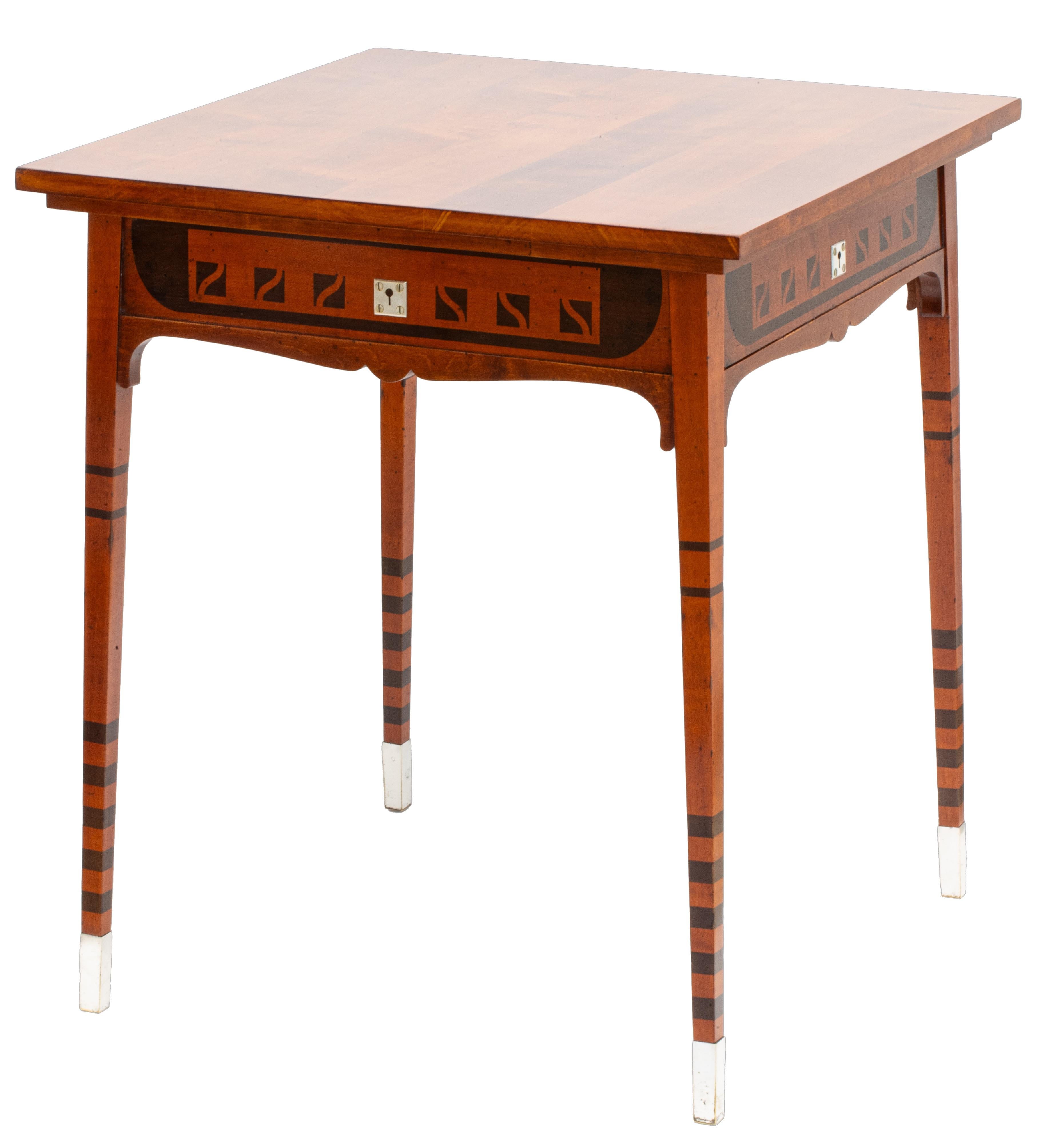 Technique: Solid maple frame, stained solid cherry wood top, stained red-brown and dark brown ornamentally, curved frame end at the bottom

This elegant Secessionist side table was created around 1900 through the collaboration of two influential