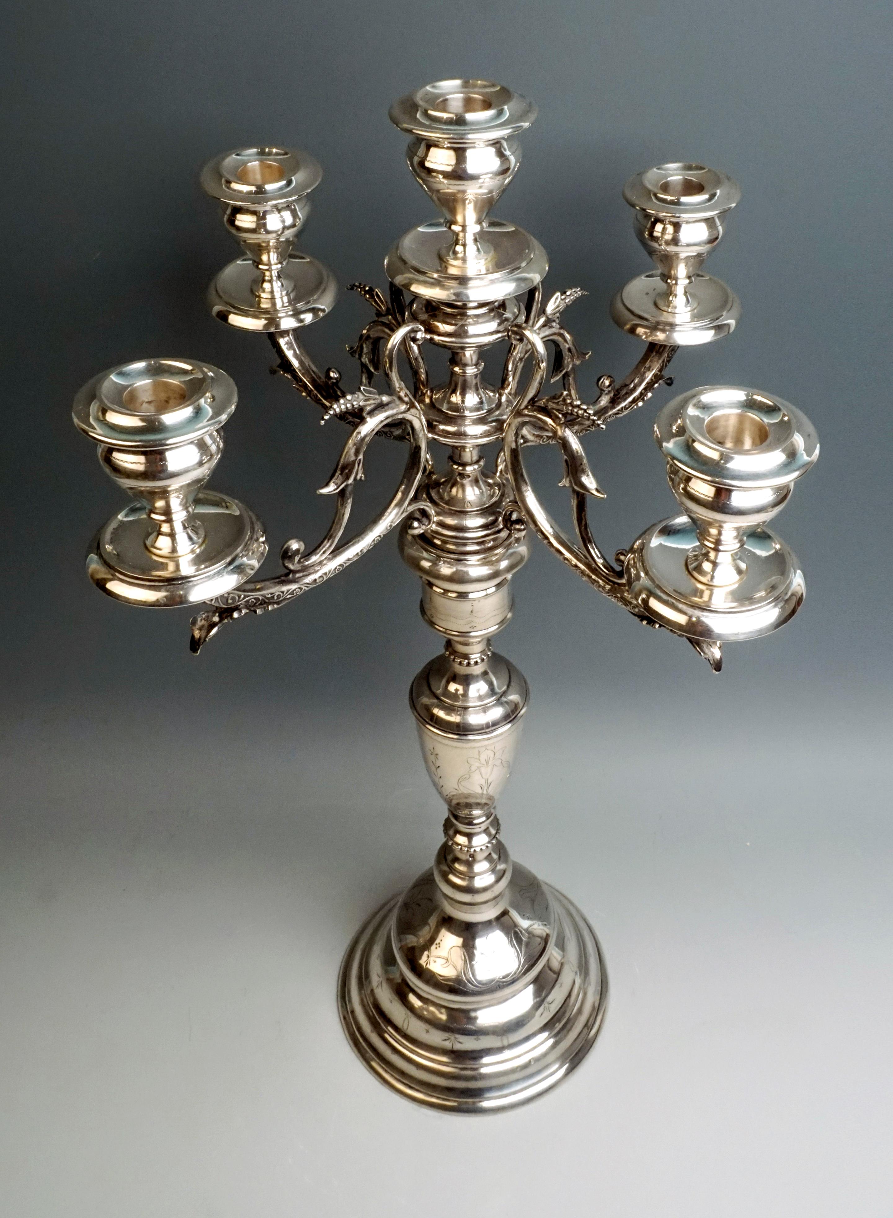 Decorative large five-light silver candelabra on a round base, with embossed and chased geometric and floral decor.

Finest work of simple elegance by the master Josef Kurzweil, active in Vienna from 1874-1912.

Made circa 1900
Branded by the