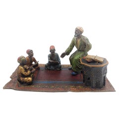 Bronce vienés "Profesor de Corán con alumnos" de Anton Chotka hacia 1900