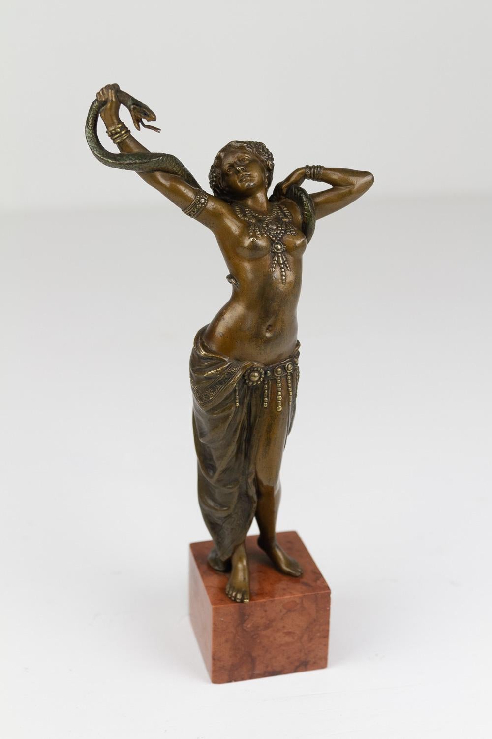 Antique Viennese Bronze Snake Dancer by Franz Xavier Bergmann, 1900s. 

Beautiful and highly detailed statue of a young woman dancing with a snake. Sculpted and manufactured in the early 20th century by Vienna bronze manufacturer Franz Xavier
