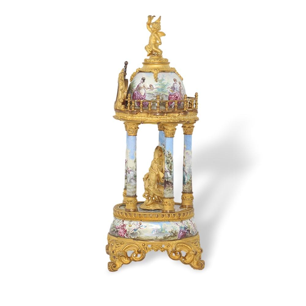 Stunning Viennese enamel table clock circa 1880. The table clock of fine form with four central columns painted extensively with gods and goddesses amongst a central figure of Diana. The top fitted with a central clock with a 1-inch dial movement
