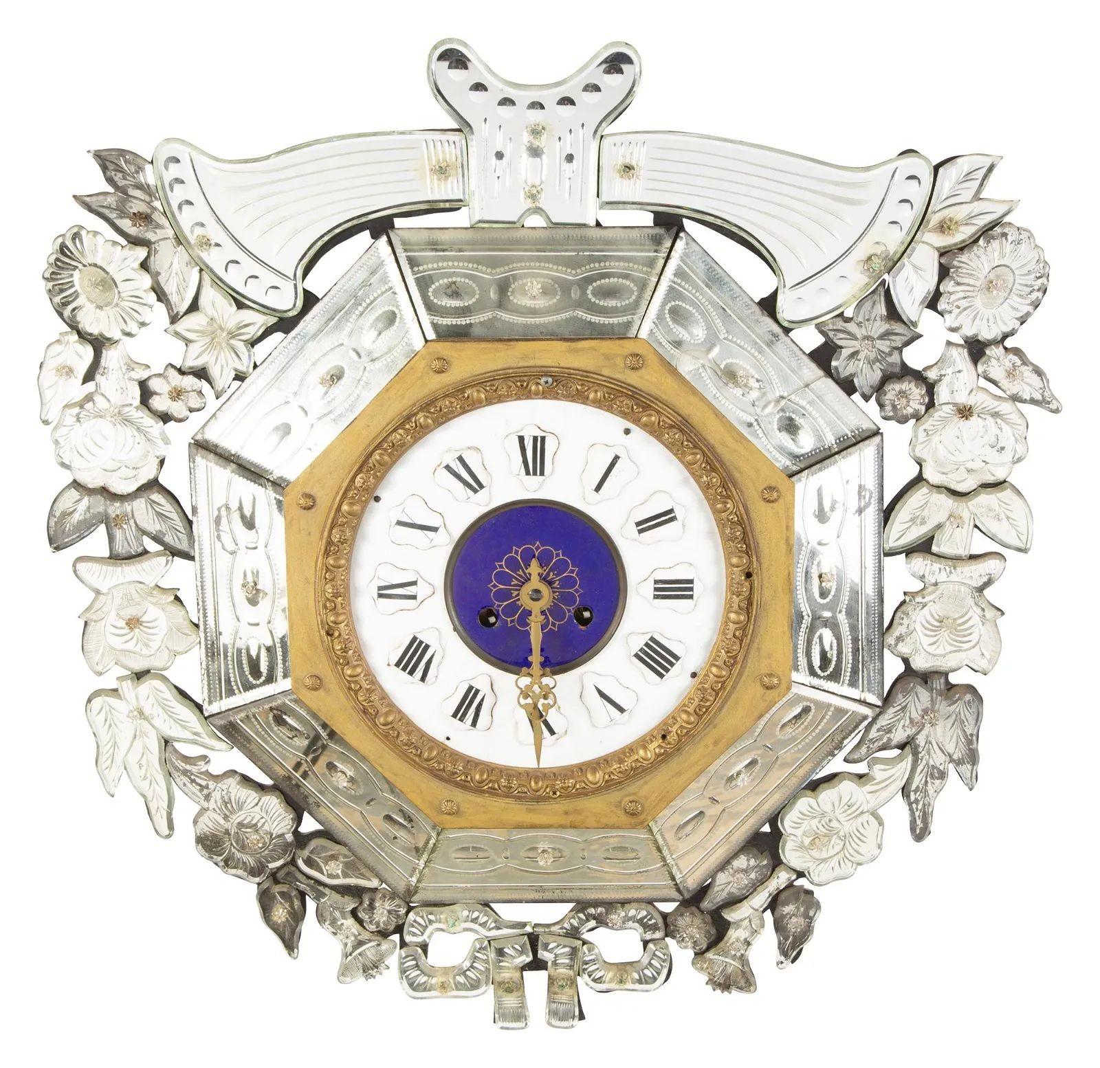 Viennese Enamel and Mirrored Hanging Wall Clock having a Porcelain Face
 
A stunning large and impressive decorative wall clock with a celeste blu and white porcelain and enamel face, refined Roman numerals and an octagonal gold frame.  The central