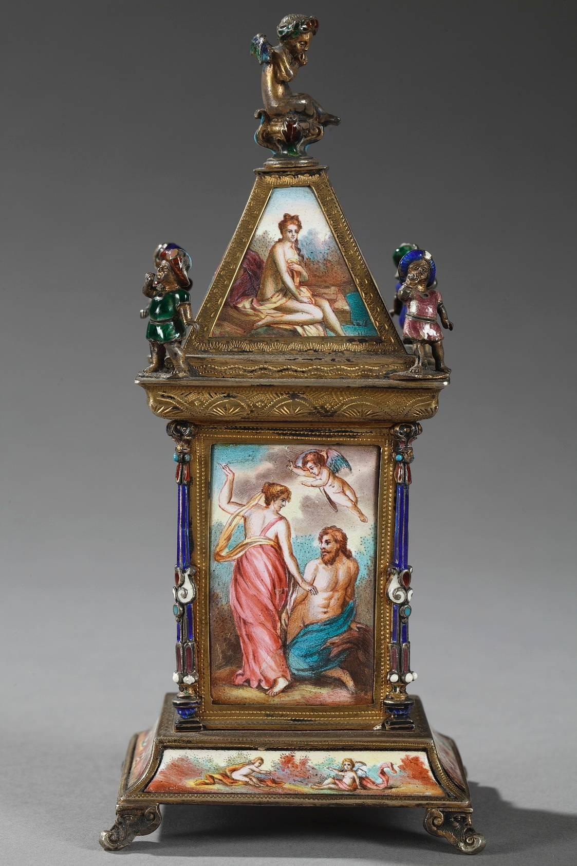 Viennese enamel and silver clock, 19th century.

Small silver and multicolored enamel clock. It is richly decorated with mythological scenes, people in flowing garments and Cupids in landscapes. The circular clock face marks the hours in Roman