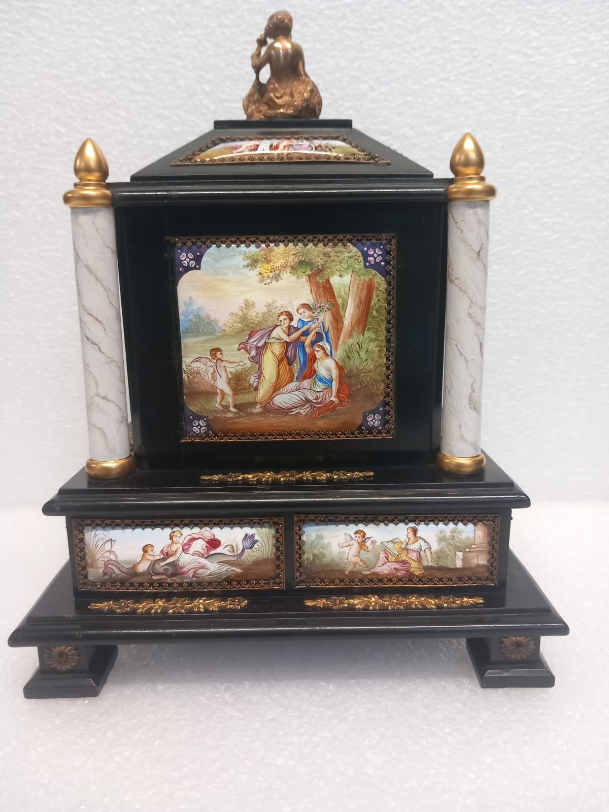 A wonderful Viennese enamel cabinet , in black ebony with gilded ormolu elements and enamel cartouches,made in the Renaissance style , circa 1860.
The front of the cabinet is decorated with two enamel plaques of dancing ladies in Roman dresses ,