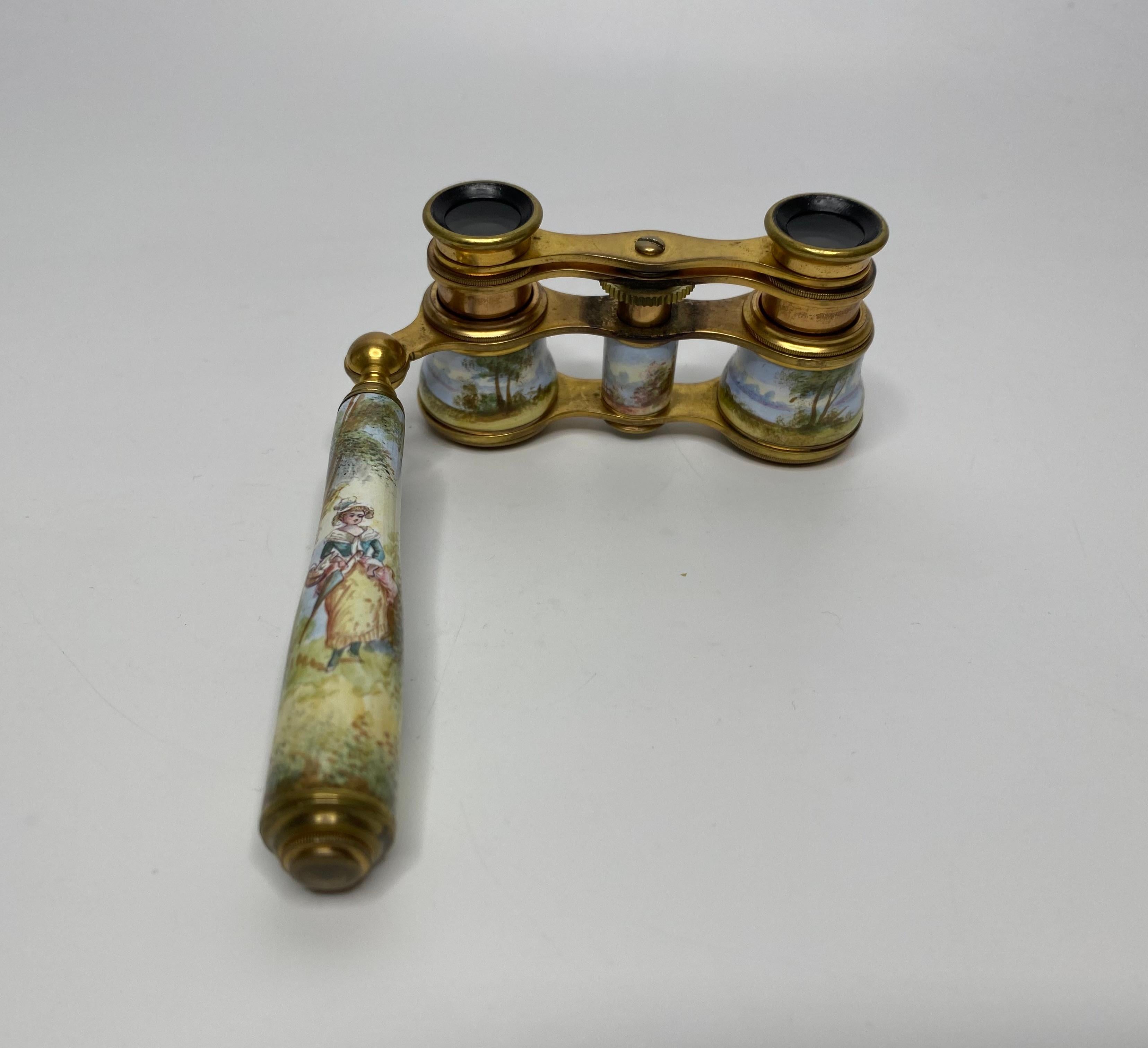 Viennese enamel opera glasses, c. 1900. The gilt metal opera glasses, having hand painted barrels of a couple wearing 18th Century costume, playing music in garden settings.
The handle with a young girl, walking in a rural setting.
Width – 10.5 cm,