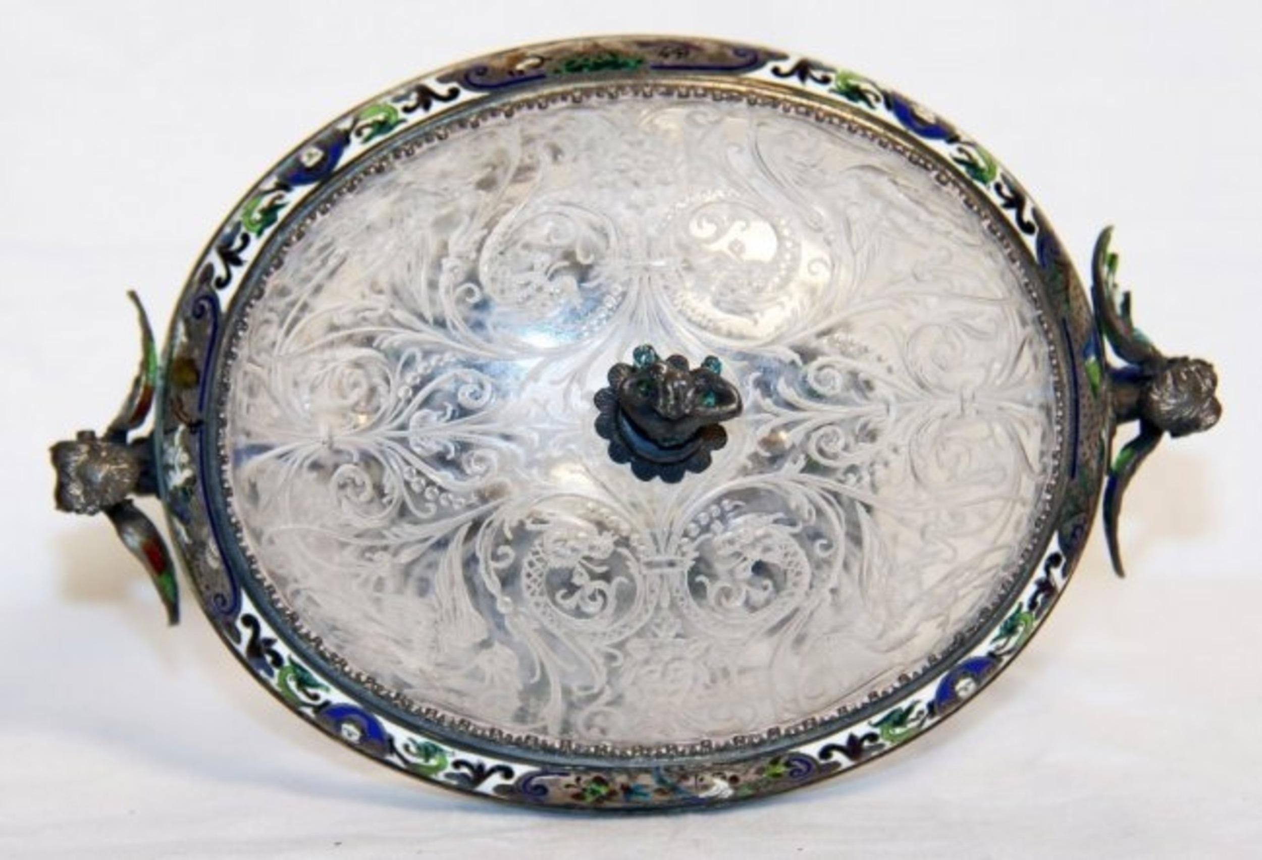Viennese mannerist style enameled silver and rock crystal coupe and cover, by Herman Bohm, last quarter 19th century, the silver mounts to base and cover with Austrian hallmarks, and maker mark for Herman Bohm.
Measures: Height 5 1/4 in.