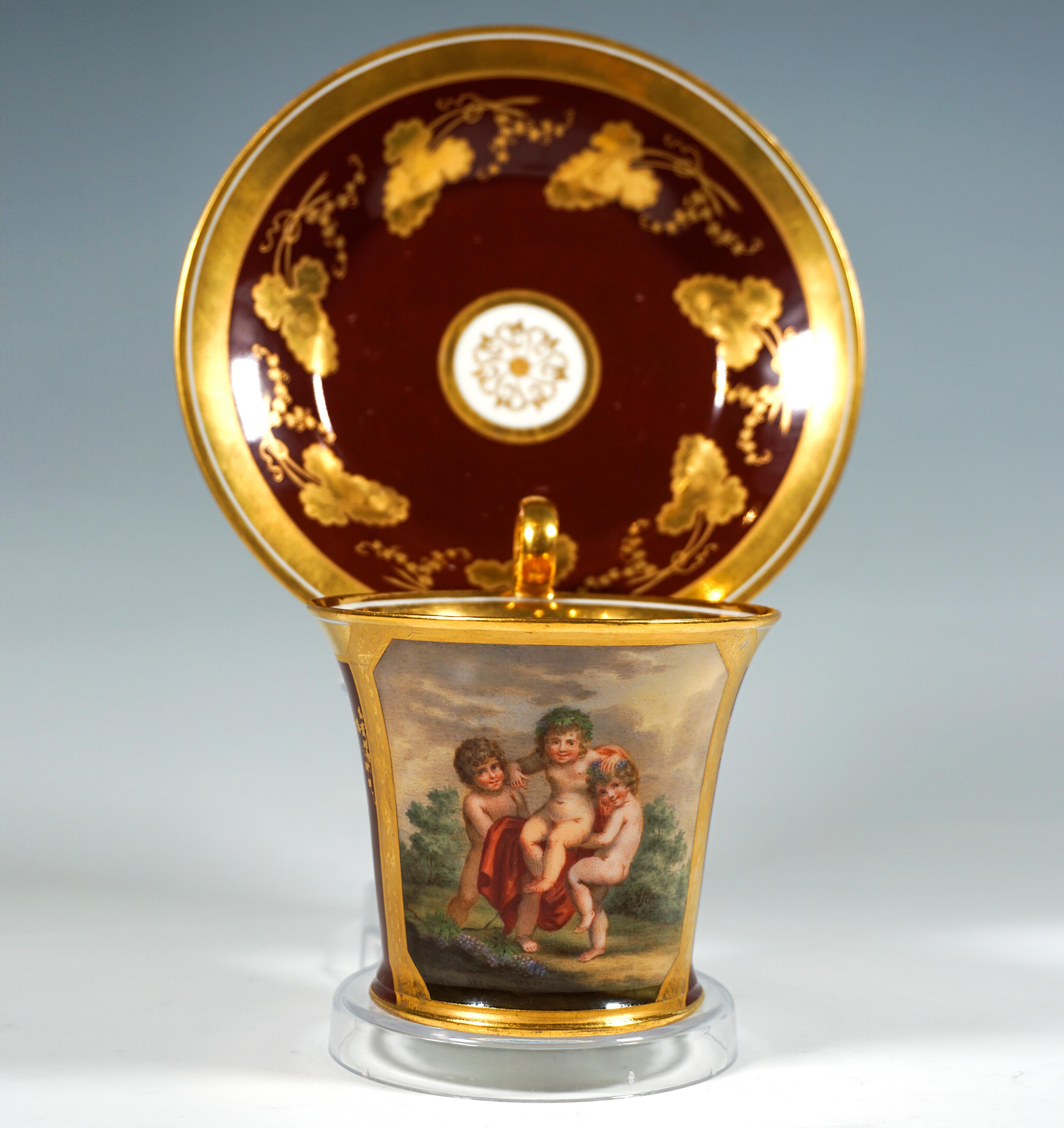 Extraordinarily decorated porcelain cup with saucer:
The front of the cup, which widens conically towards the top, is decorated with a polychrome motif over its entire height: two putti in front of a park landscape with a cloudy sky lifting a third