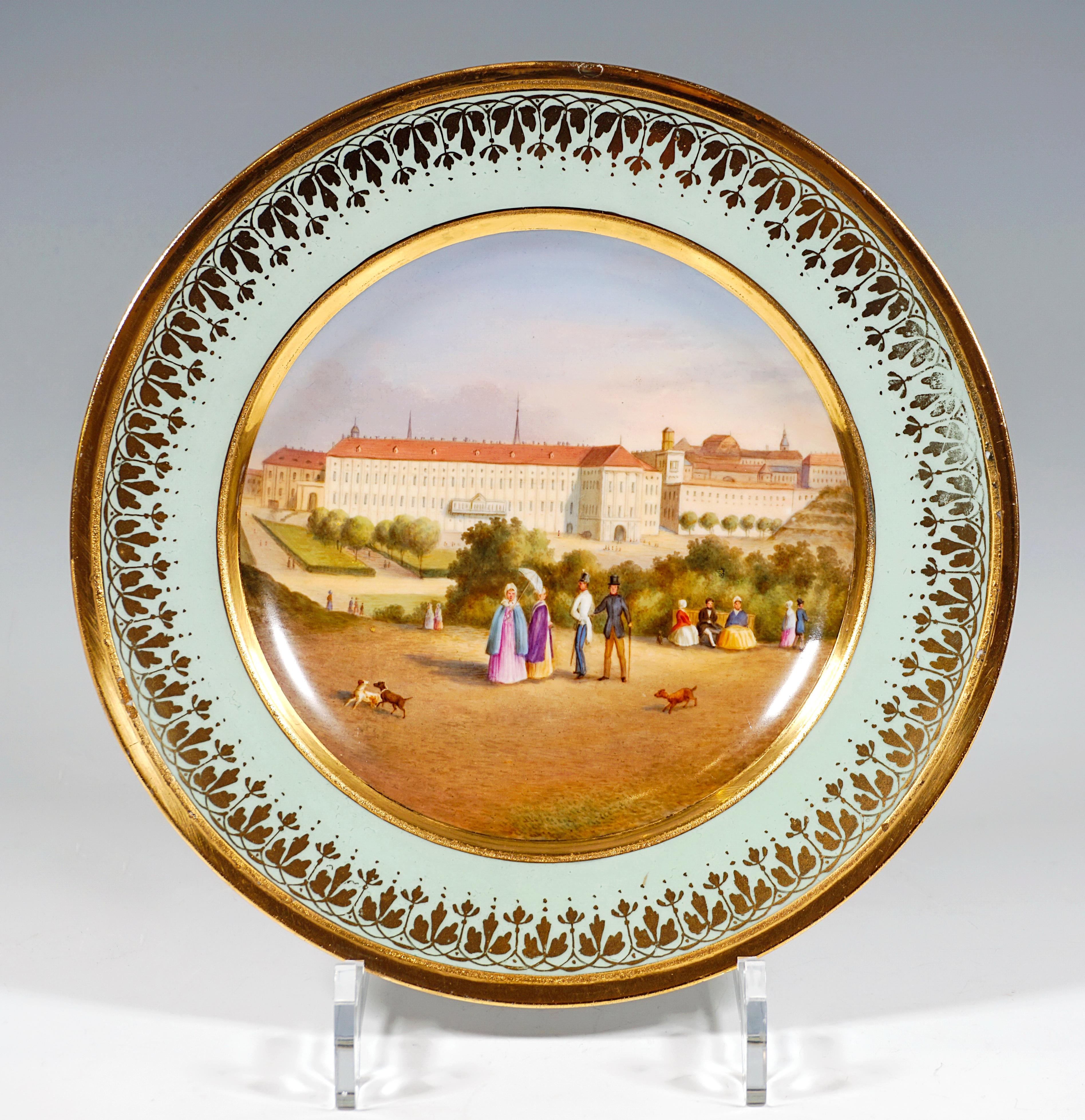 Porcelain picture plate with a fine polychrome painted veduta: in the mirror a view of the Vienna Hofburg, the Leopoldine Wing with ceremonial apartments and the outer Burgplatz, seen from the Glacis, with a staffage 
of figures. The Viennese