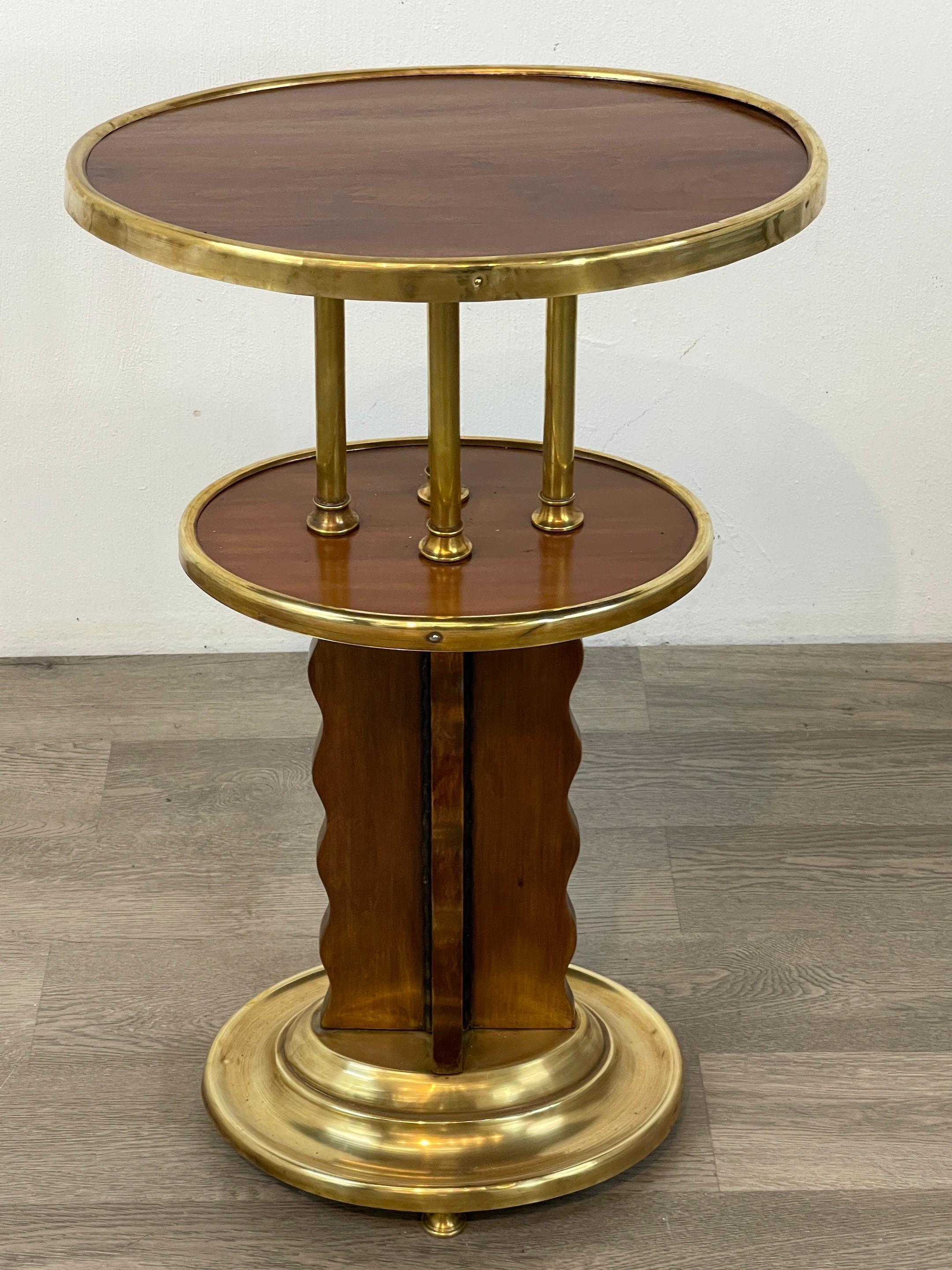 Viennese secession brass mounted hardwood side table, Austria C. 1920
With oval brass mounted hardwood top, raised a four brass column pedestal base, with circular tapered footed base. Unsigned.
 