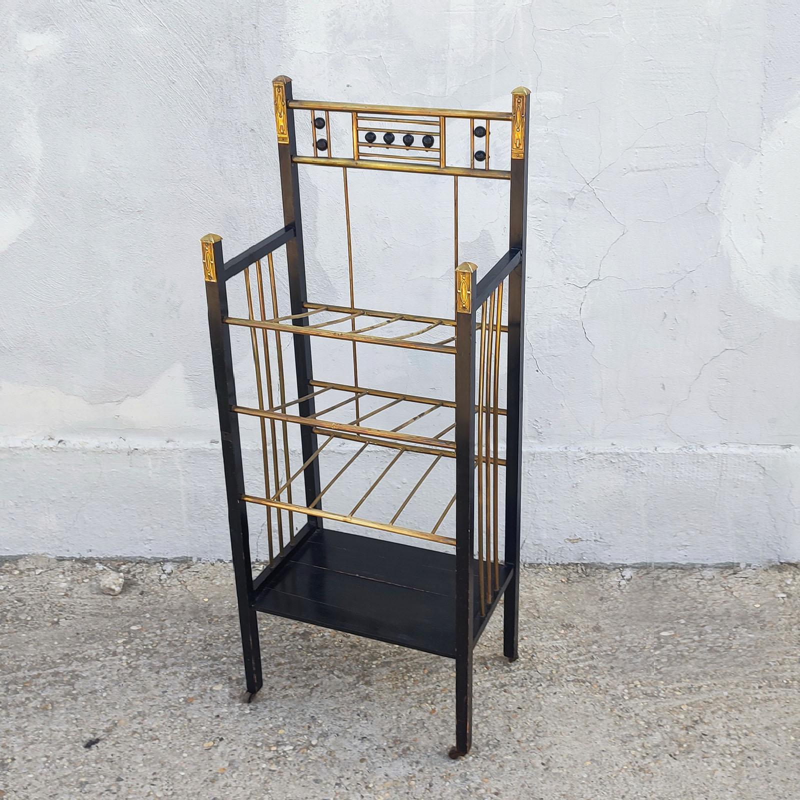 Viennese Secession Stand or Etagere in the Style of Koloman Moser, circa 1900
An elegant ebonized wood and brass etagere/magazine stand/bookcase that suits any contemporary or traditional environment.
Good used original condition with normal wear