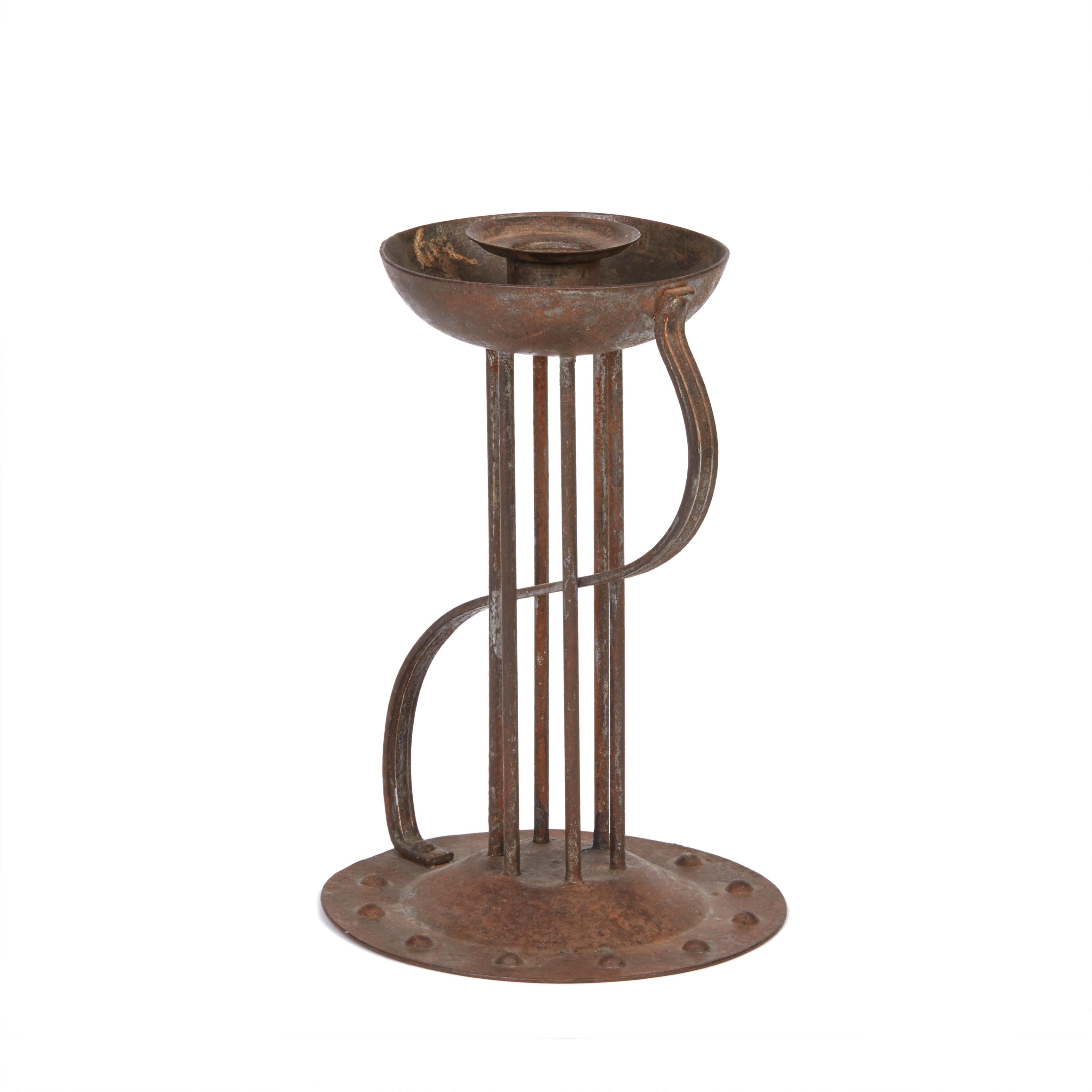 A stylish secessionist Industrial art iron candlestick or Chamberstick made and designed by Hugo bergère. As part of the Viennese secessionist movement the work of Hugo bergère was seen as cutting edge and was sold through a number of iconic outlets