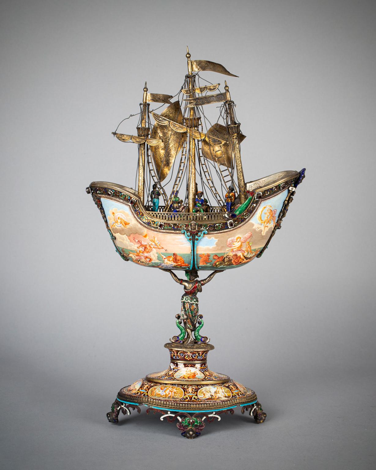 Finely enamelled in large and small panels with mythological scenes relating to water, the silver and enamel figural decoration further embellished with masks, dolphins and strapwork.
