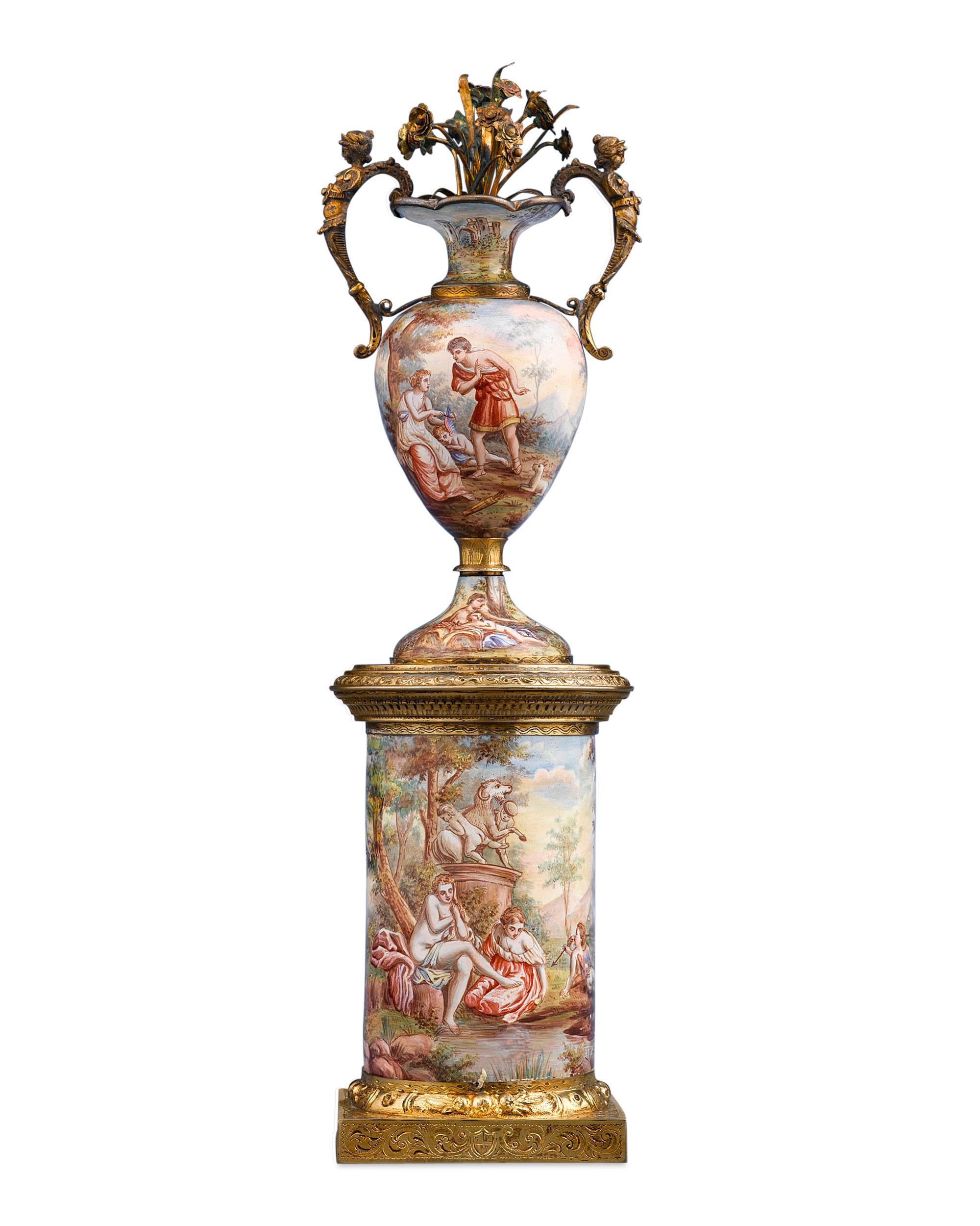 Splendid continuous hand painted scenes adorn this graceful and rare Viennese enamel vase and matching pedestal. Depicting diverse images from classical mythology, these scenes are executed with exceptional detail and artistry. The classical theme