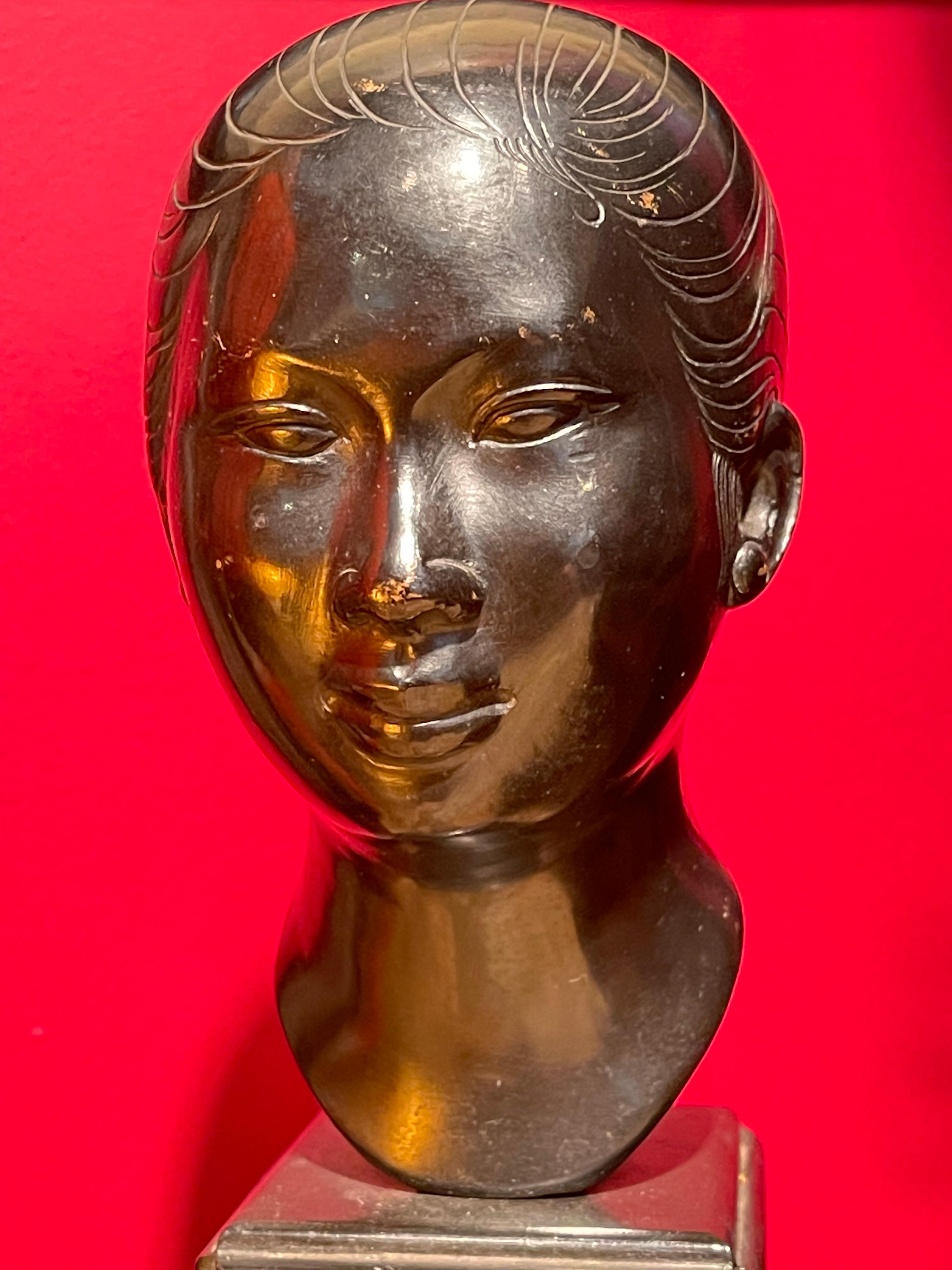 Vietnamese Art Deco Lacquered Bronze Bust of Asian Woman by Nguen Than, Ca. 1920

Signed by the artist.

DIMENSIONS
Height: 7 inches
Width: 3.5 inches
Depth: 3 inches

ABOUT SCULPTURE
This early 20th Century (ca. 1920) head sculpture of an Asian