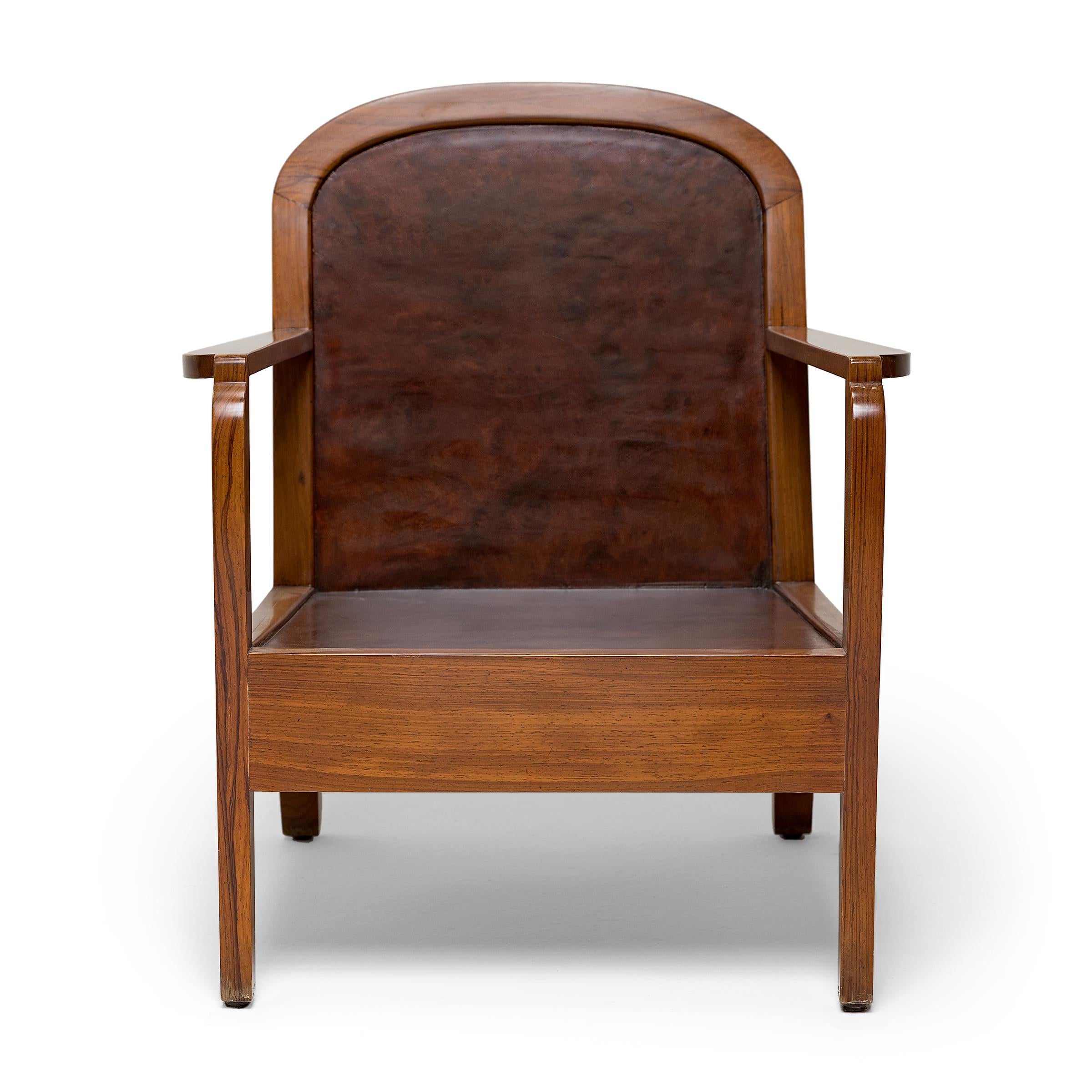 This Vietnamese Deco armchair is characterized by clean lines and smooth contours. Dated to the 1940s, the armchair is designed in the timeless style of the Art Deco period, when traditional art and furniture was reimagined with streamlined form and