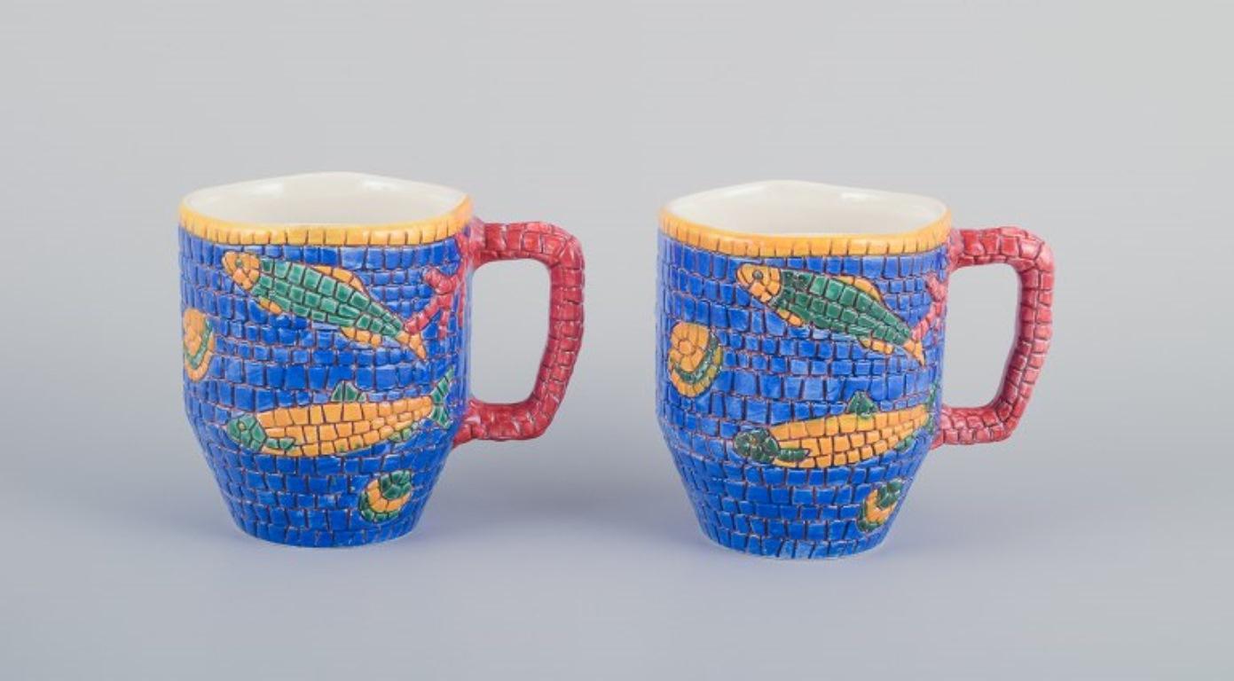 Vietri, Italy. Set of four large ceramic mugs. Decorated with fish and sea motifs in a mosaic-like pattern.
Late 20th century.
Marked.
In perfect condition.
Dimensions: Height 10.8 cm x Diameter 9.0 cm (excluding handle).
