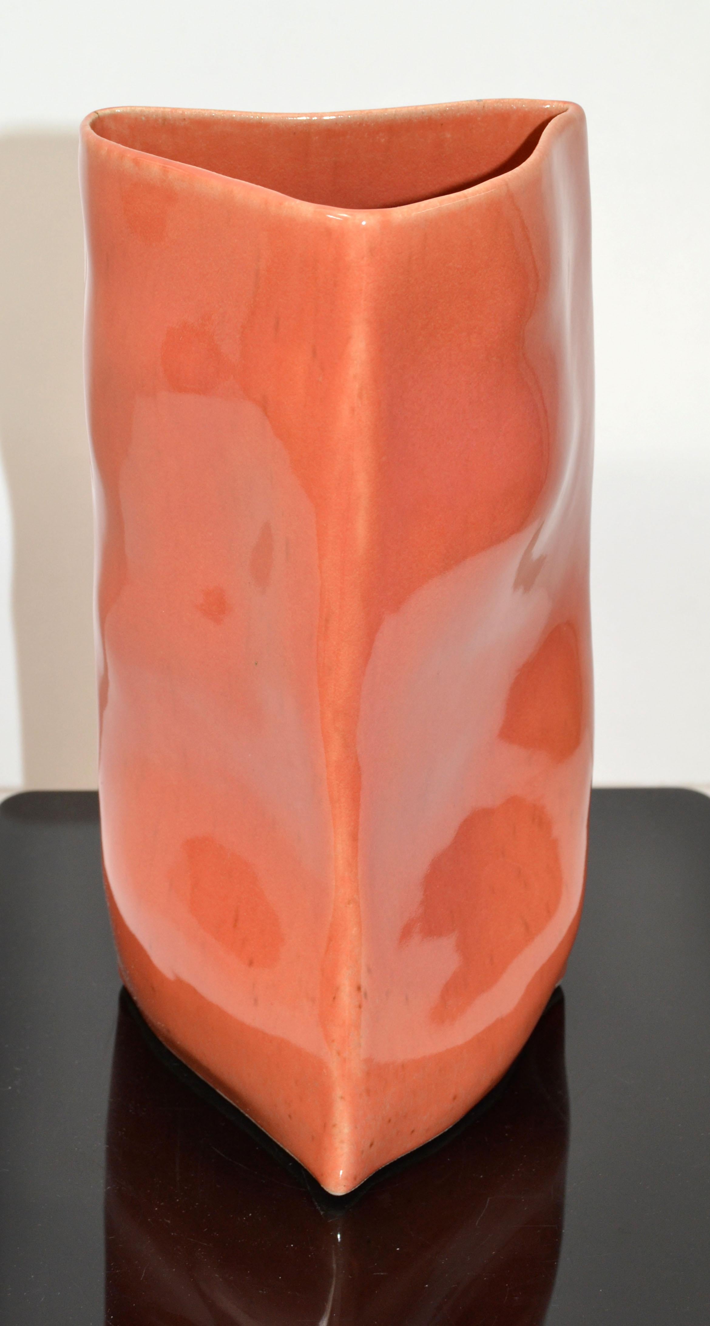 Italian Mid-Century Modern glazed ceramic vase, pottery in triangle geometric shape in apricot color.
Marked at the base, Vietri, made in Italy.