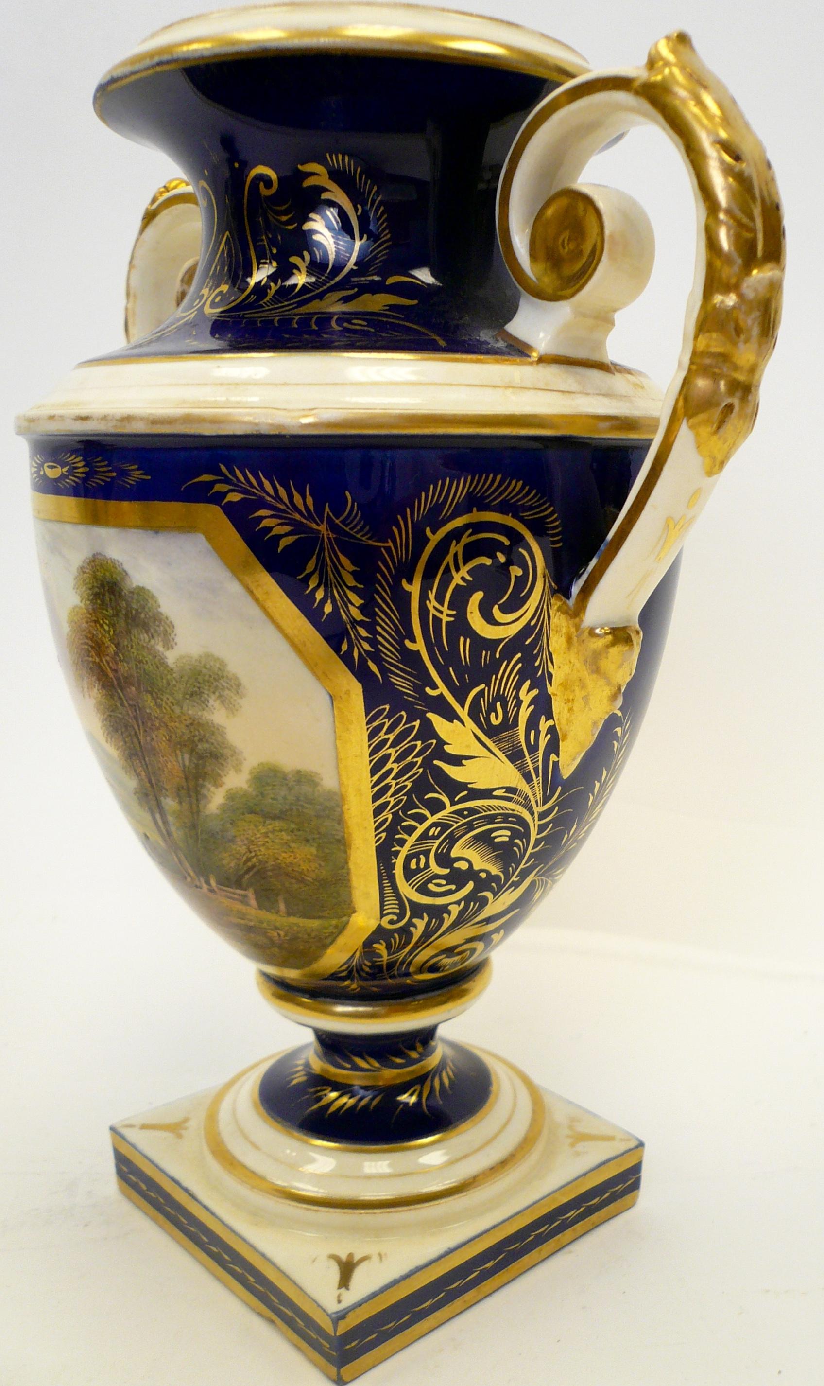 This Regency period Derby porcelain urn features a beautifully hand-painted view of the welsh countryside.










 