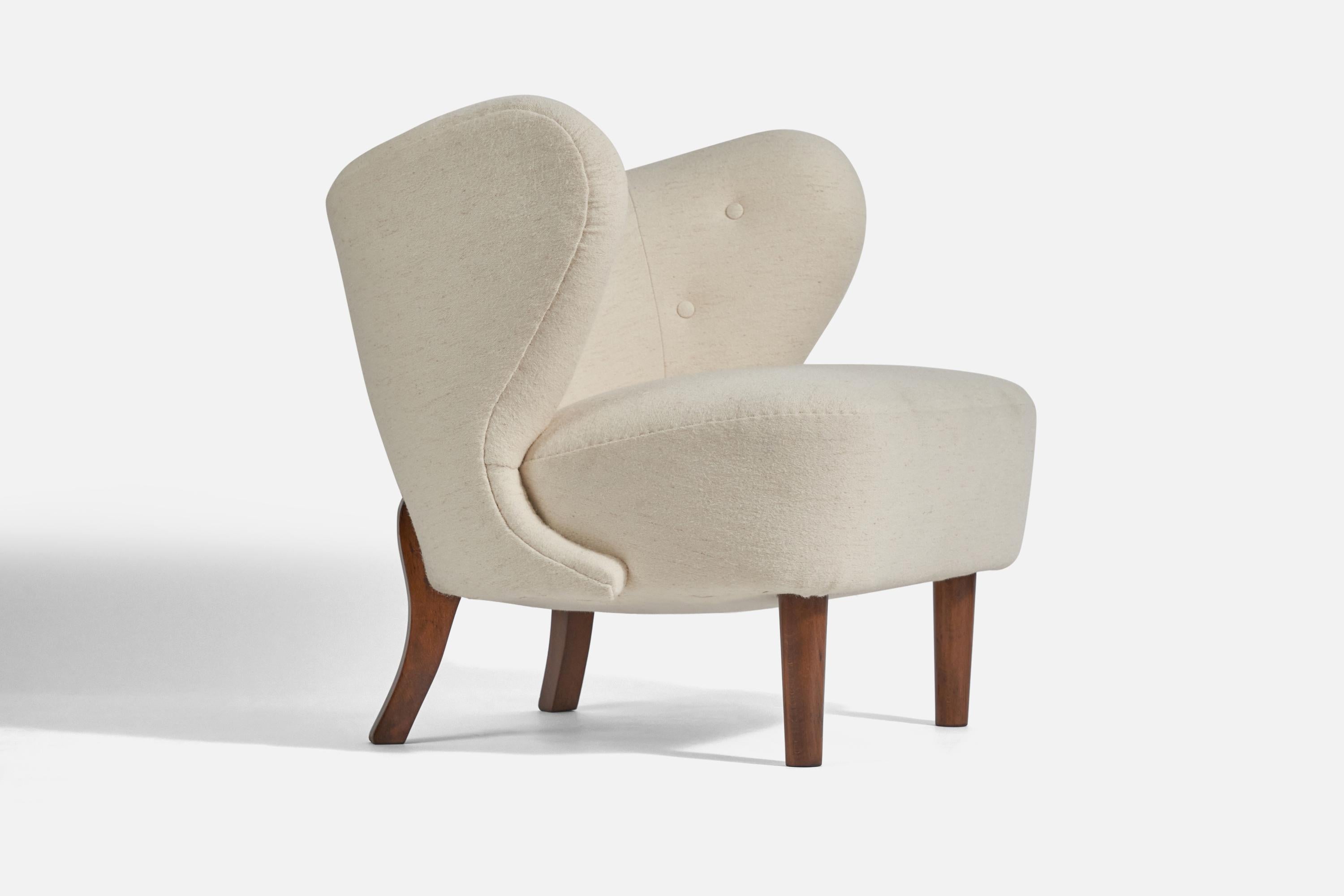 A white fabric and beech lounge chair, design attributed to Viggo Boesen and production attributed to A.J. Iversen, Denmark, c. 1940s. 