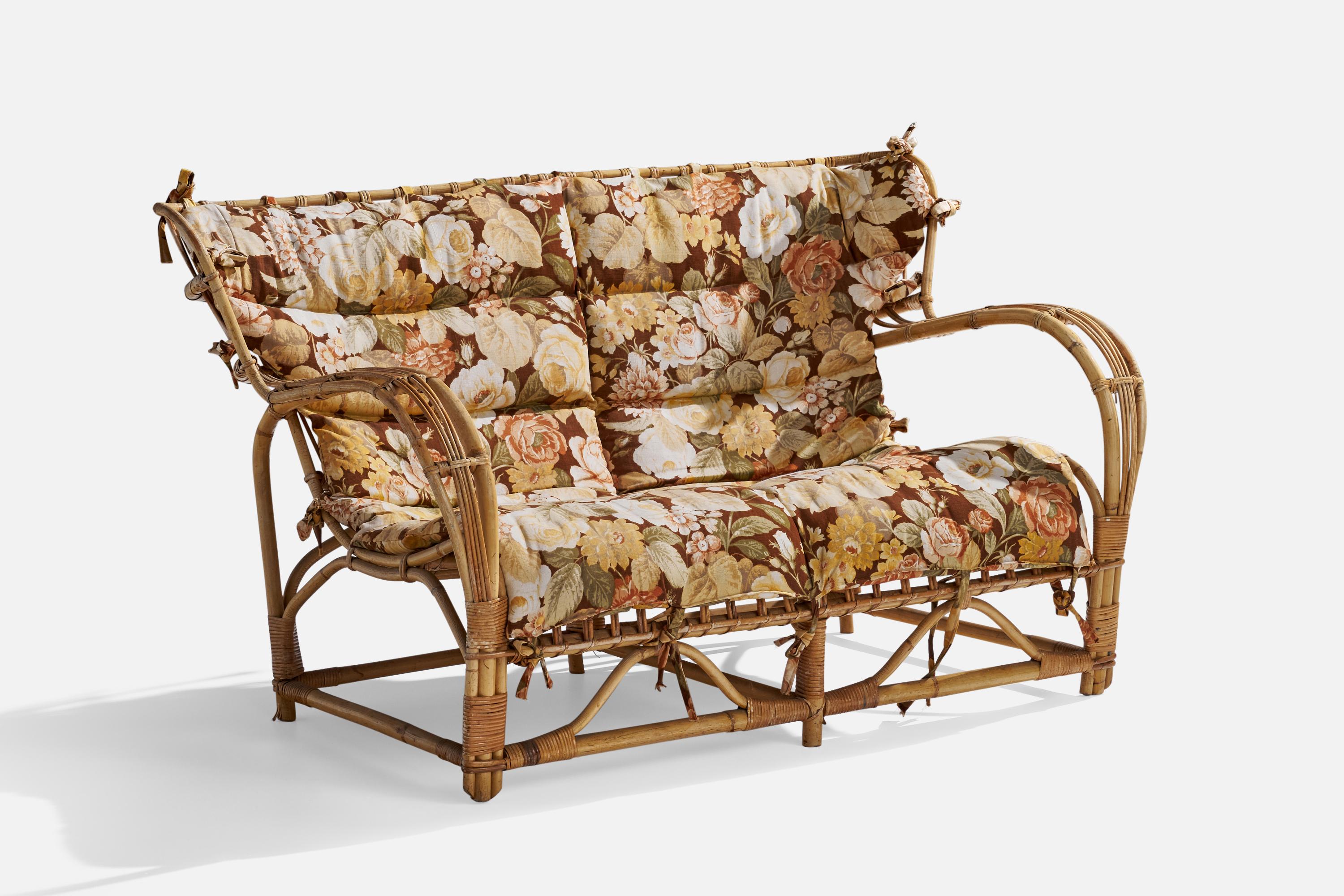 A moulded bamboo, rattan and floral-printed fabric sofa or settee attributed to Viggo Boesen and produced in Sweden, c. 1940s.

Seat height 15.5”.