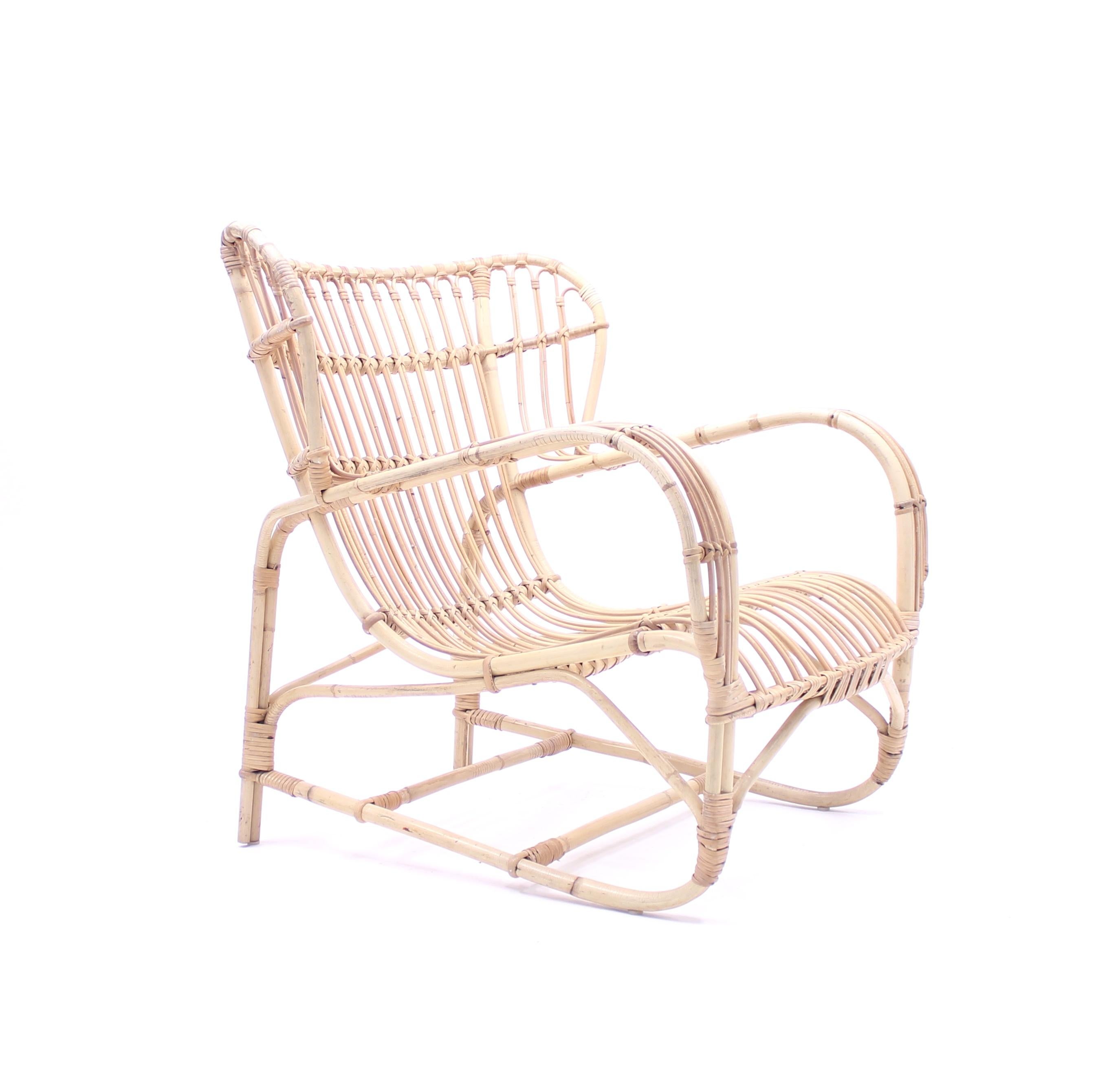 Bamboo and rattan lounge chair designed by Danish architect Viggo Boesen in the 1930s. This example of an unknown producer is of a slightly later production, circa 1960s. Good vintage condition with ware consistent with age and use.