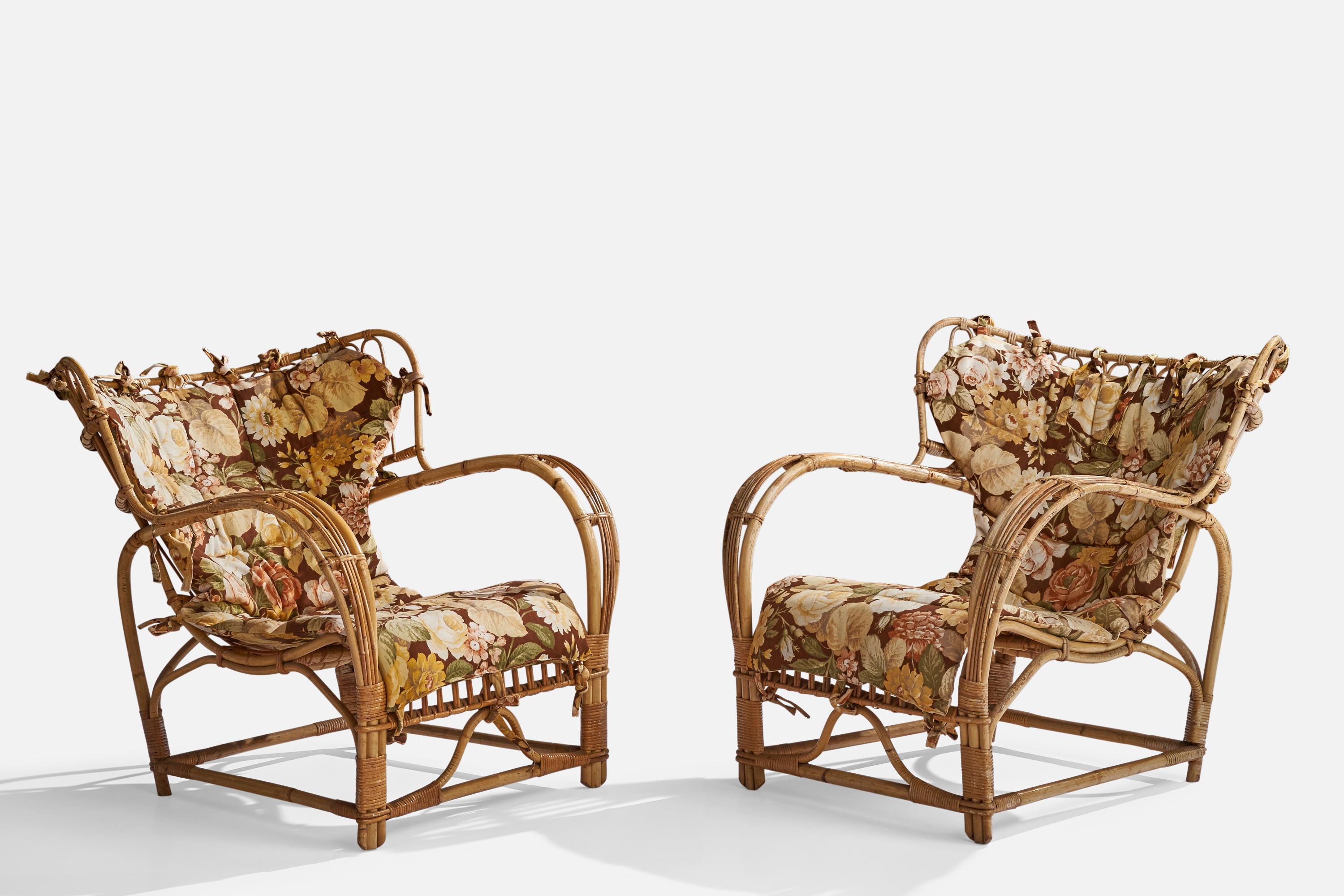 A pair of moulded bamboo, rattan and flower-printed fabric lounge chairs design attributed to Viggo Boesen, produced in Sweden, 1940s. 

Seat height 14.25”