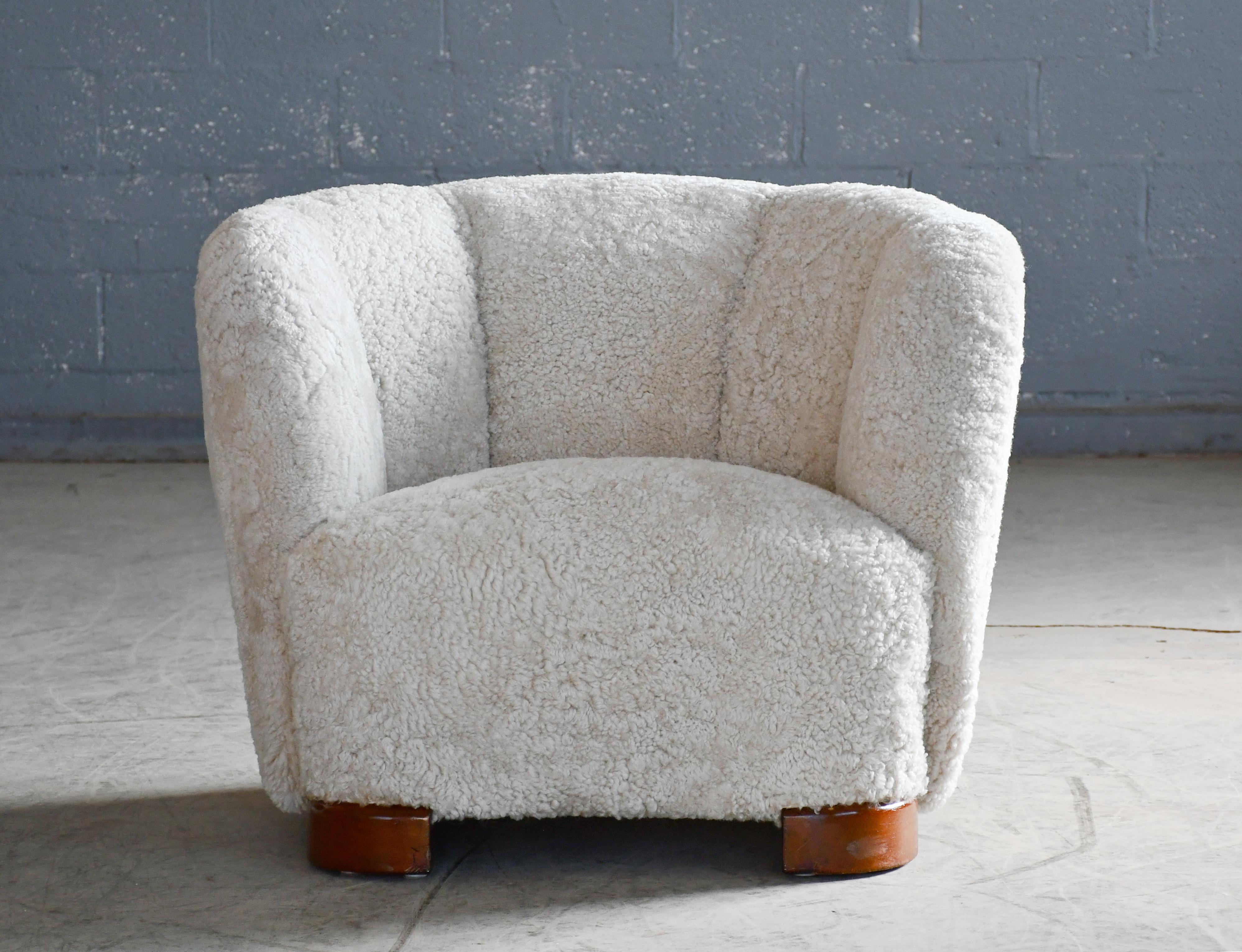 Comfortable, exuberant, and ultracool Danish lounge chair from the 1930-40's. These type of chairs were produced as companions to the curved 